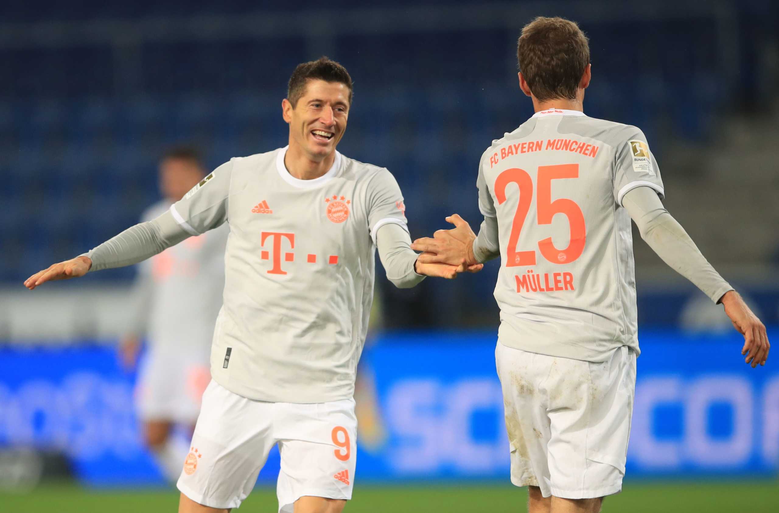Soccer Football - Bundesliga - Arminia Bielefeld v Bayern Munich - Bielefelder Alm, Bielefeld, Germany - October 17, 2020 Bayern Munich's Robert Lewandowski celebrates scoring their third goal with Thomas Muller Pool via REUTERS