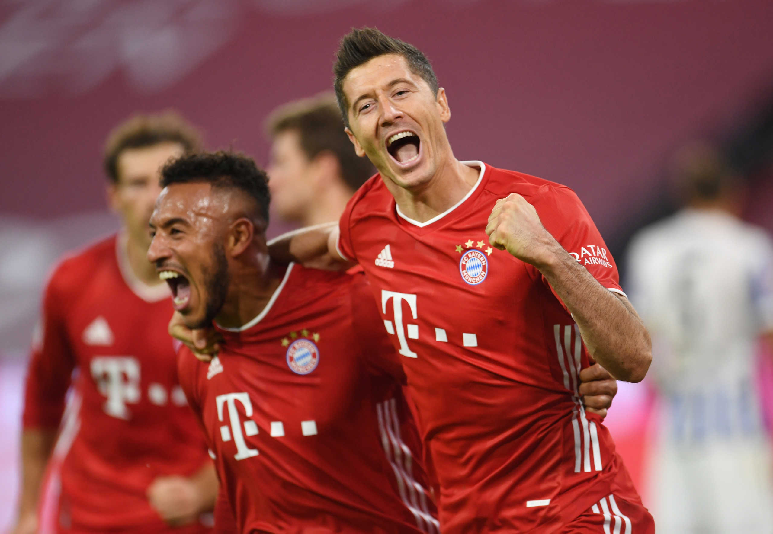 Soccer Football - Bundesliga - Bayern Munich v Hertha BSC - Allianz Arena, Munich, Germany - October 4, 2020. Bayern Munich’s Robert Lewandowski celebrates scoring their fourth goal with Corentin Tolisso. REUTERS