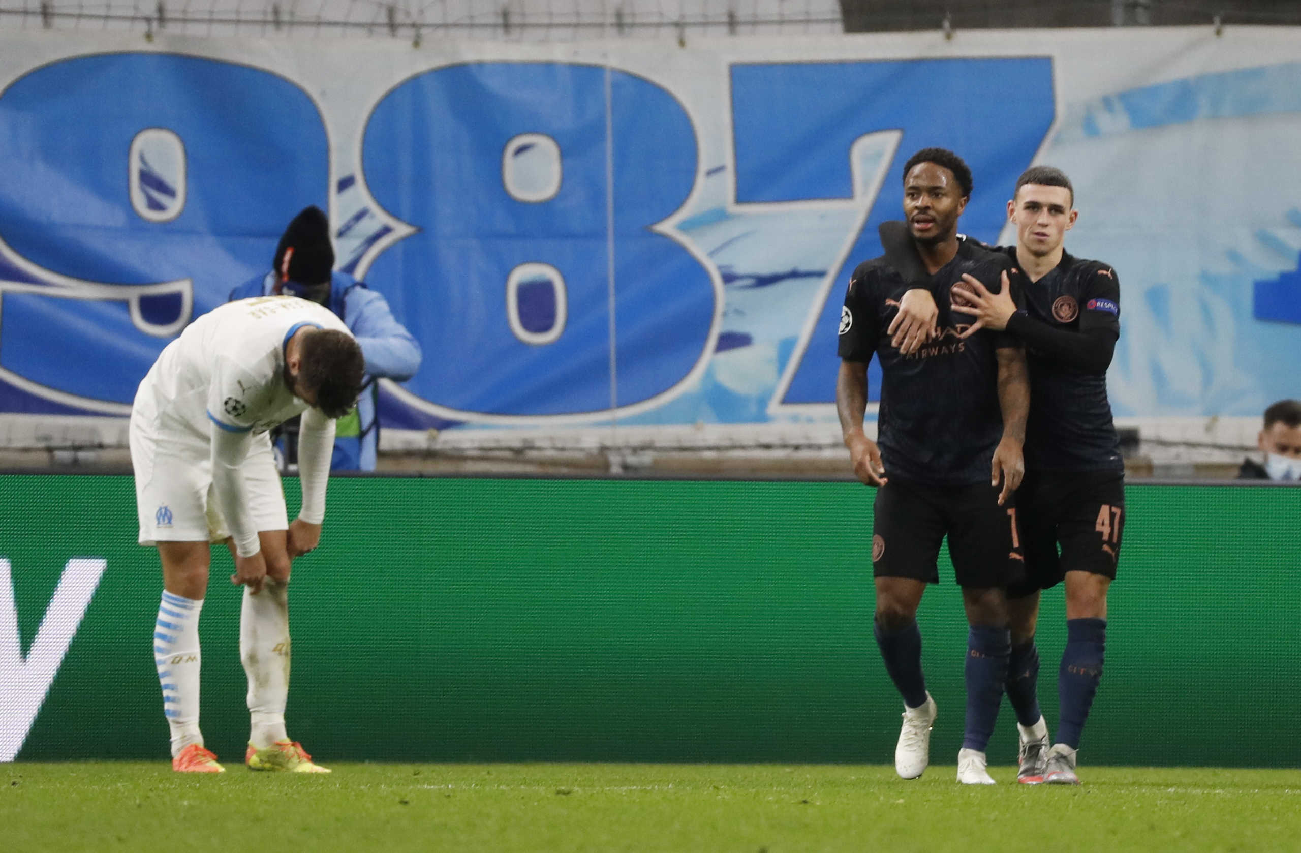 Soccer Football - Champions League - Group C - Olympique Marseille v Manchester City - Orange Velodrome, Marseille, France - October 27, 2020 Manchester City's Raheem Sterling celebrates scoring their third goal with Phil Foden REUTERS