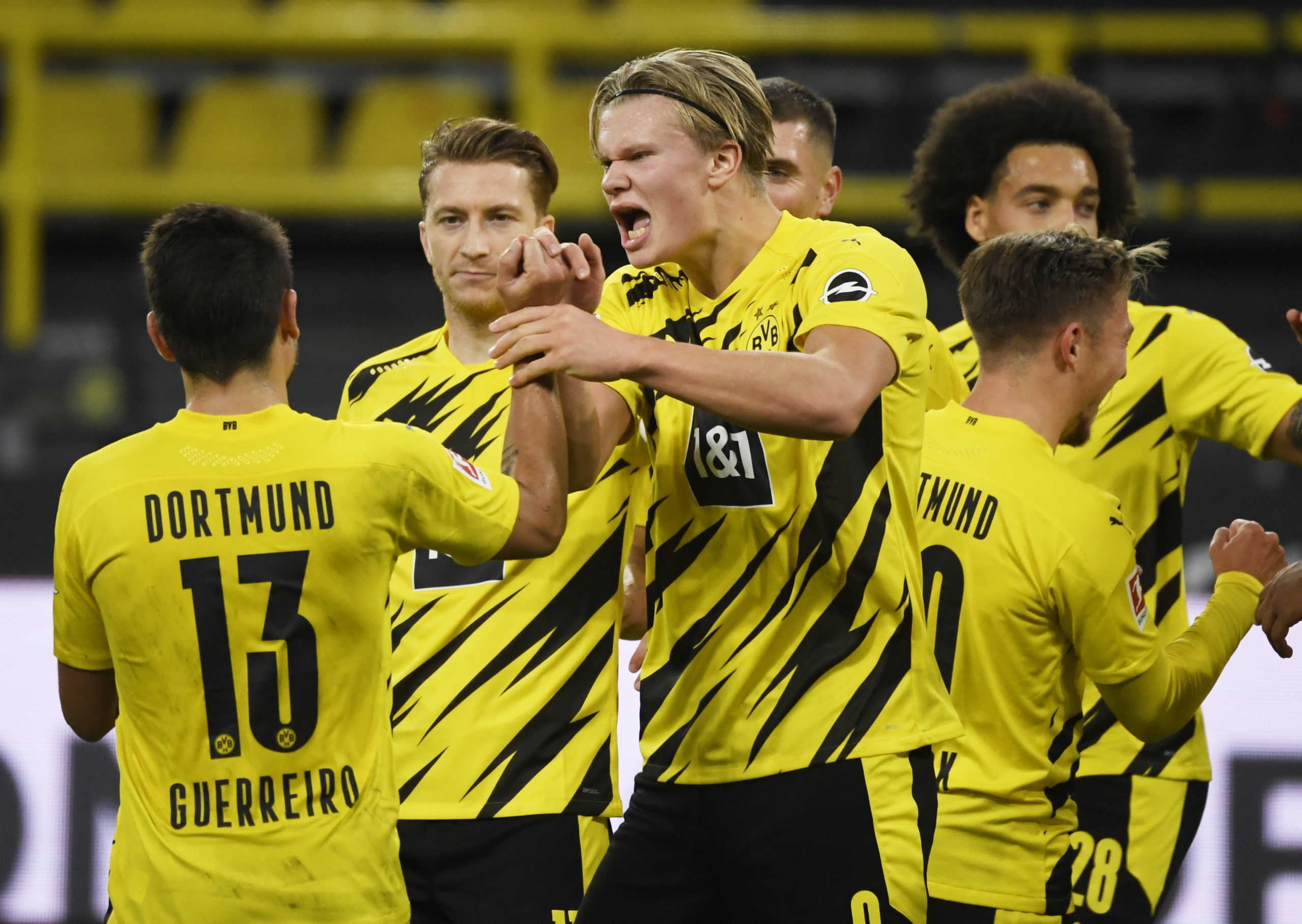 Soccer Football - Bundesliga - Borussia Dortmund v Schalke 04 - Signal Iduna Park, Dortmund, Germany - October 24, 2020  Borussia Dortmund's Erling Haaland celebrates with teammates after Mats Hummels scored their third goal  Pool via REUTERS
