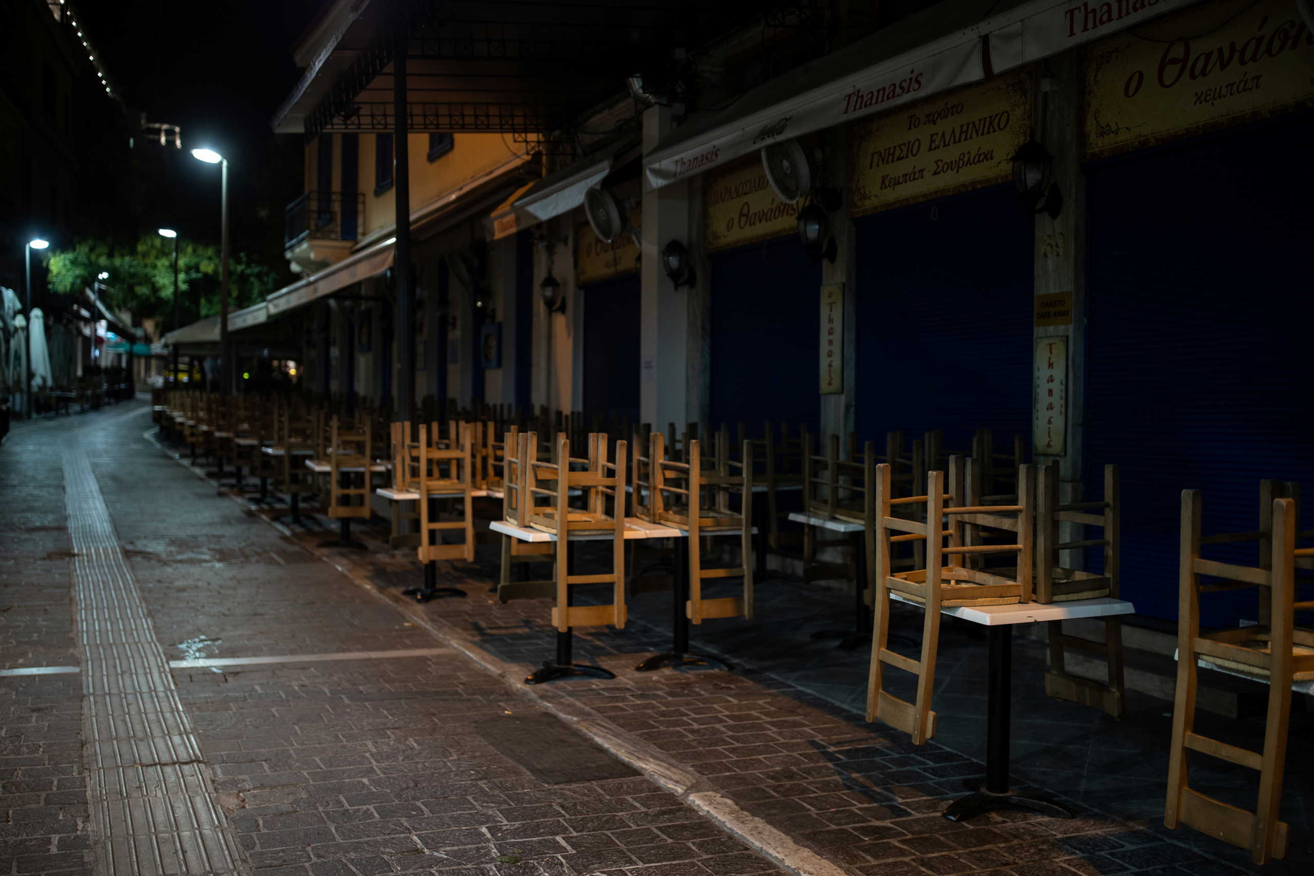 A closed restaurant on Monastiraki square after the Greek government imposed a night curfew from 00:30 to 05:00 to prevent the spread of the coronavirus disease (COVID-19), in Athens, Greece, October 25, 2020. REUTERS