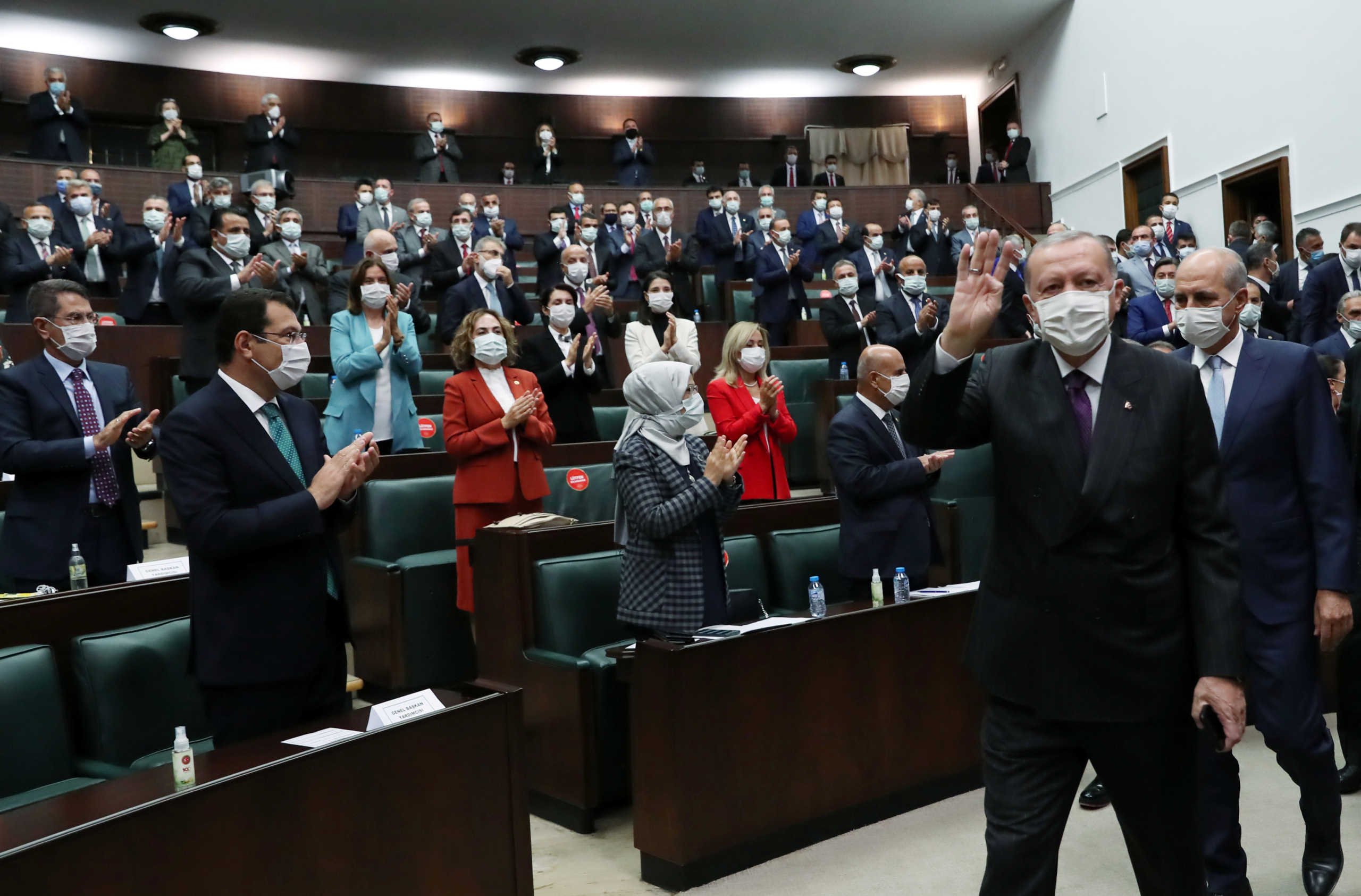 Turkish President Tayyip Erdogan greets members of his ruling AK Party (AKP) during a meeting at the parliament in Ankara, Turkey, October 14, 2020. Murat Cetinmuhurdar