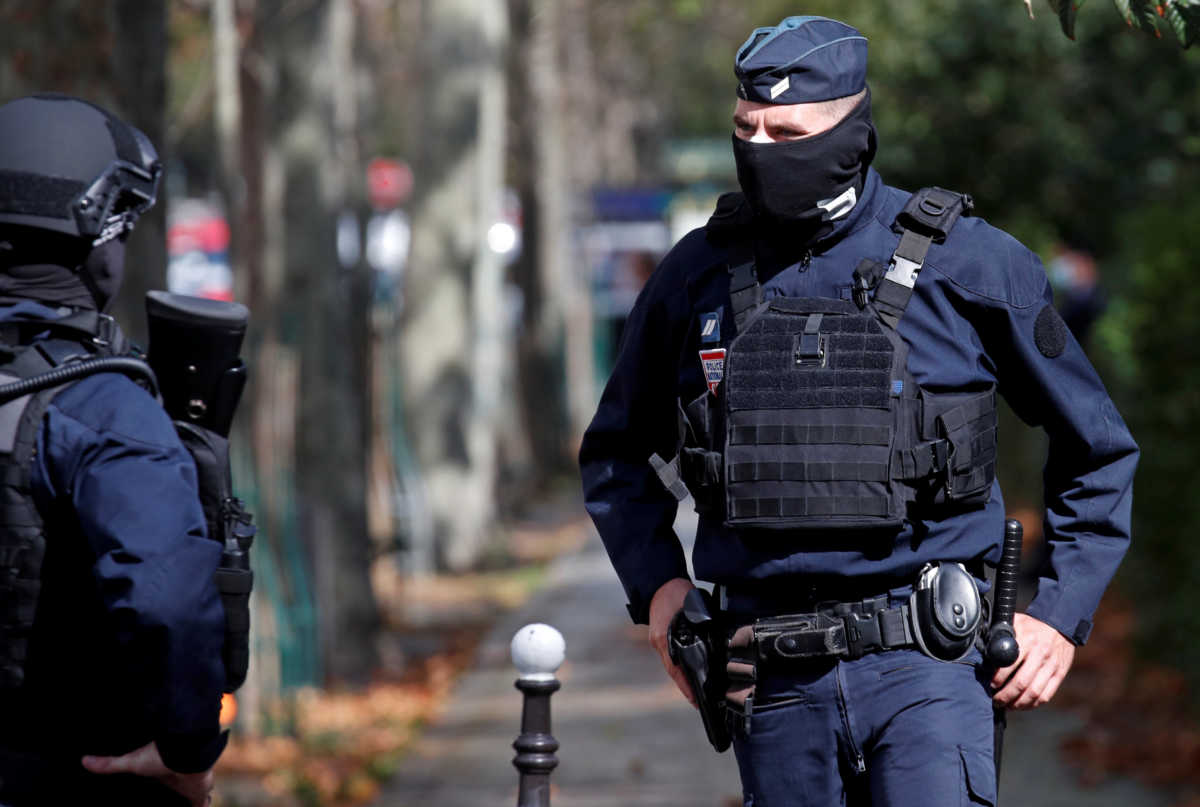 Police are seen at the scene of an incident near the former offices of French magazine Charlie Hebdo, in Paris, France September 25, 2020. REUTERS
