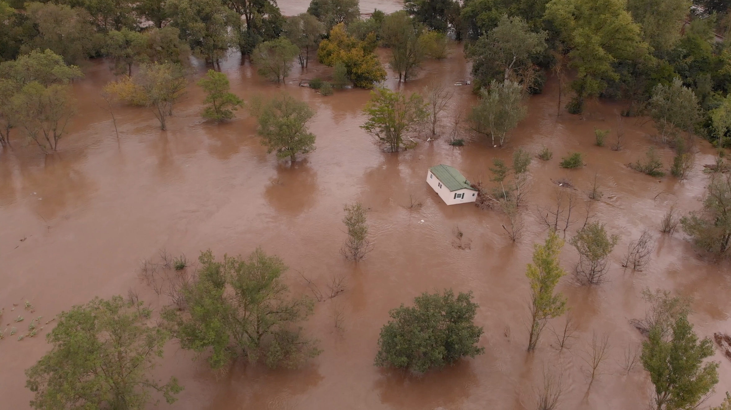 A house floats down the river after flash flooding occurred in the region, in Anduze, France September 19, 2020, in this still image taken from a video obtained from social media. Facebook