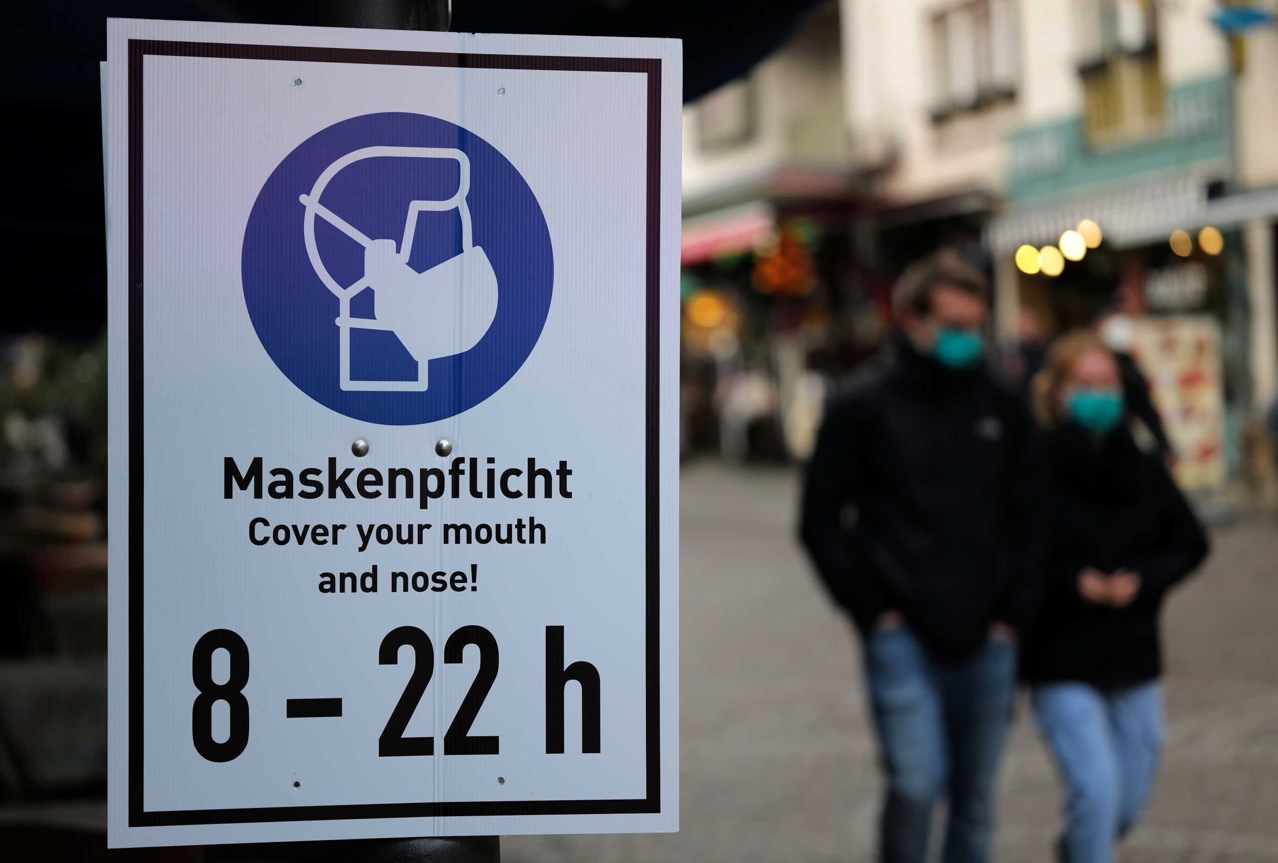 People wearing protective masks as they walk through a pedestrian area as the spread of the coronavirus disease (COVID-19) continues in Frankfurt, Germany, October 27, 2020. REUTERS