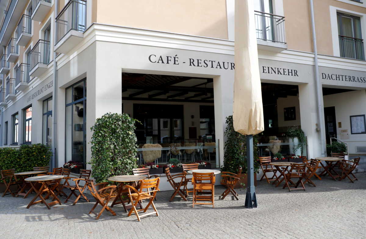 Empty chairs are pictured outside a restaurant, after residents of the Berchtesgadener Land district of Bavaria will not be able to leave their homes from October 20, 2020, without a valid reason for two weeks, making it the first area in Germany to go back into lockdown since April, in the city of Berchtesgaden, Germany October 20, 2020. REUTERS