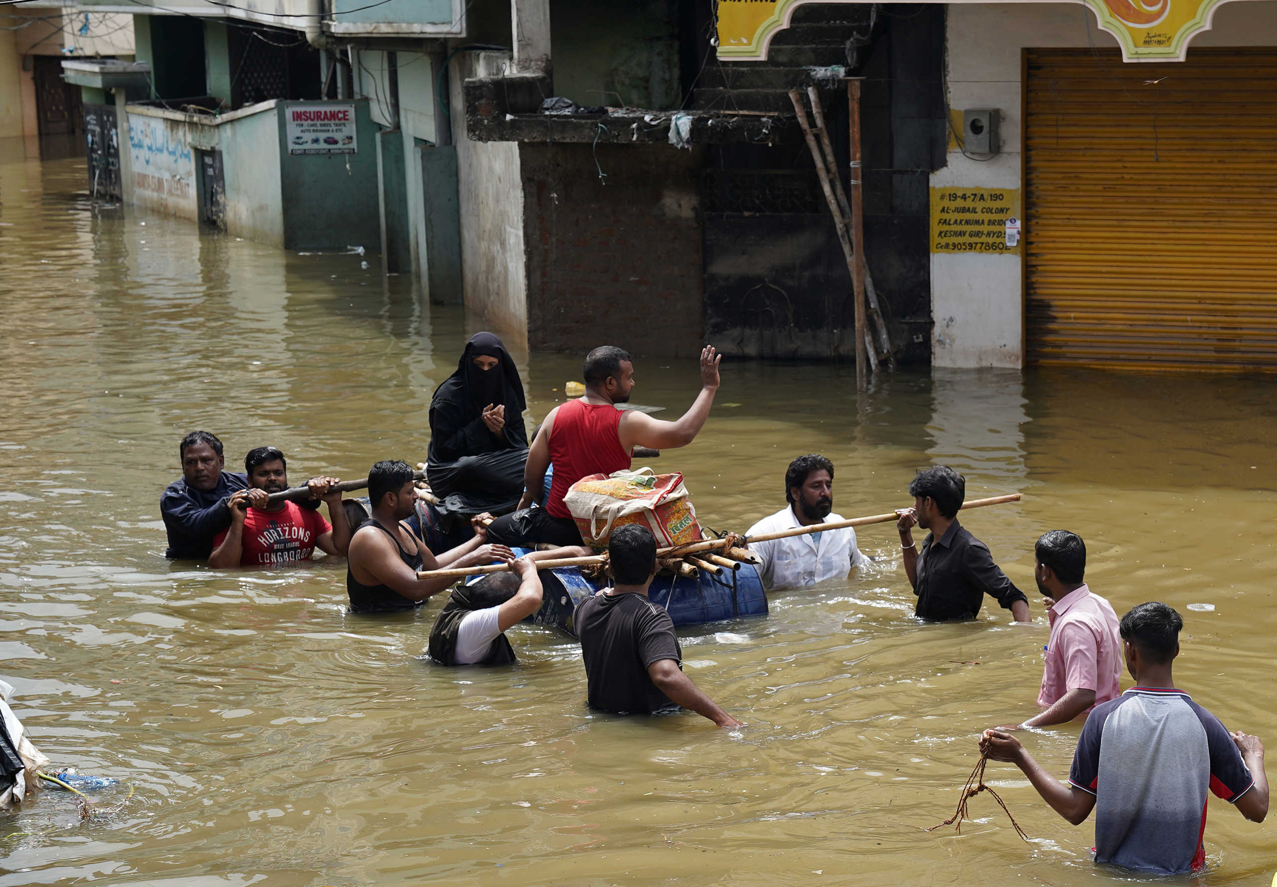 Residents are evacuated from a flooded neighbourhood after heavy rainfall in Hyderabad, the capital of the southern state of Telangana, India, October 15, 2020. REUTERS