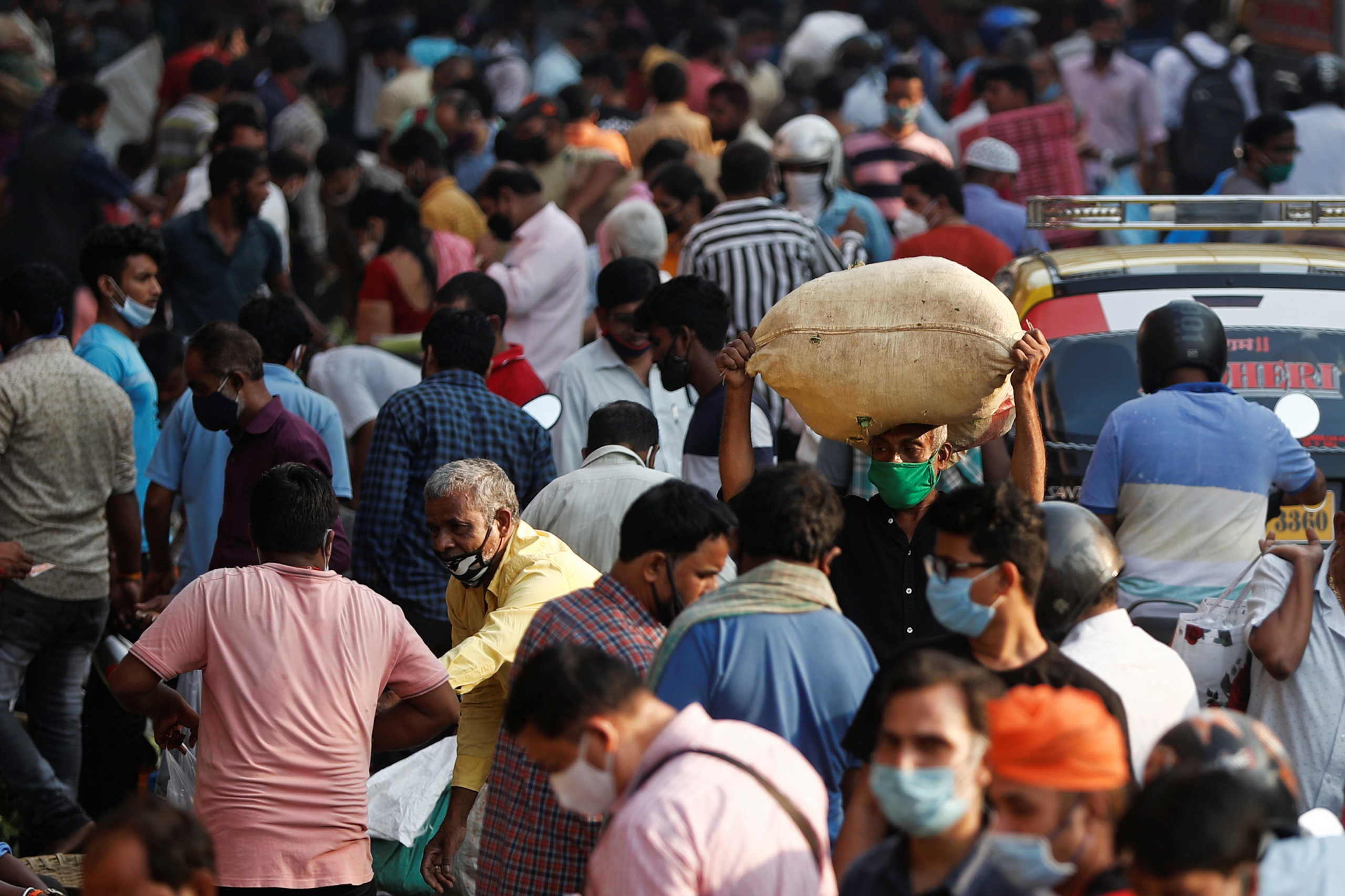 People are seen at a crowded market amidst the spread of the coronavirus disease (COVID-19) in Mumbai, India, October 29, 2020. REUTERS