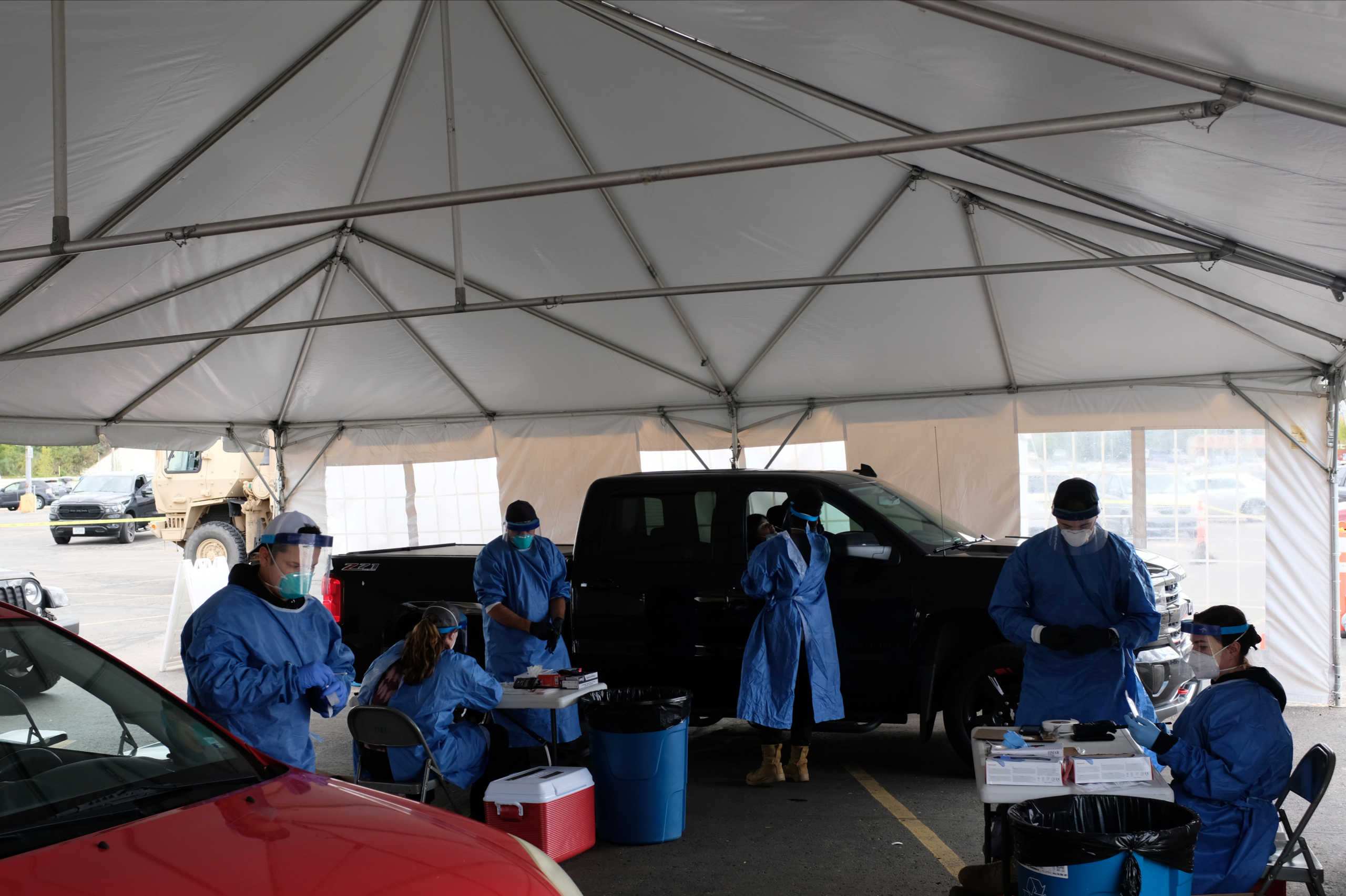 Personnel administer coronavirus disease (COVID-19) tests in Milwaukee, Wisconsin, U.S., as cases spread in the Midwest, October 2, 2020.  REUTERS