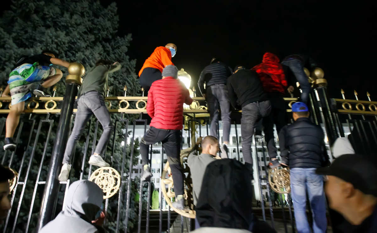 Protesters try to break into the government headquarters during a rally against the result of a parliamentary election in Bishkek, Kyrgyzstan, October 5, 2020.  REUTERS