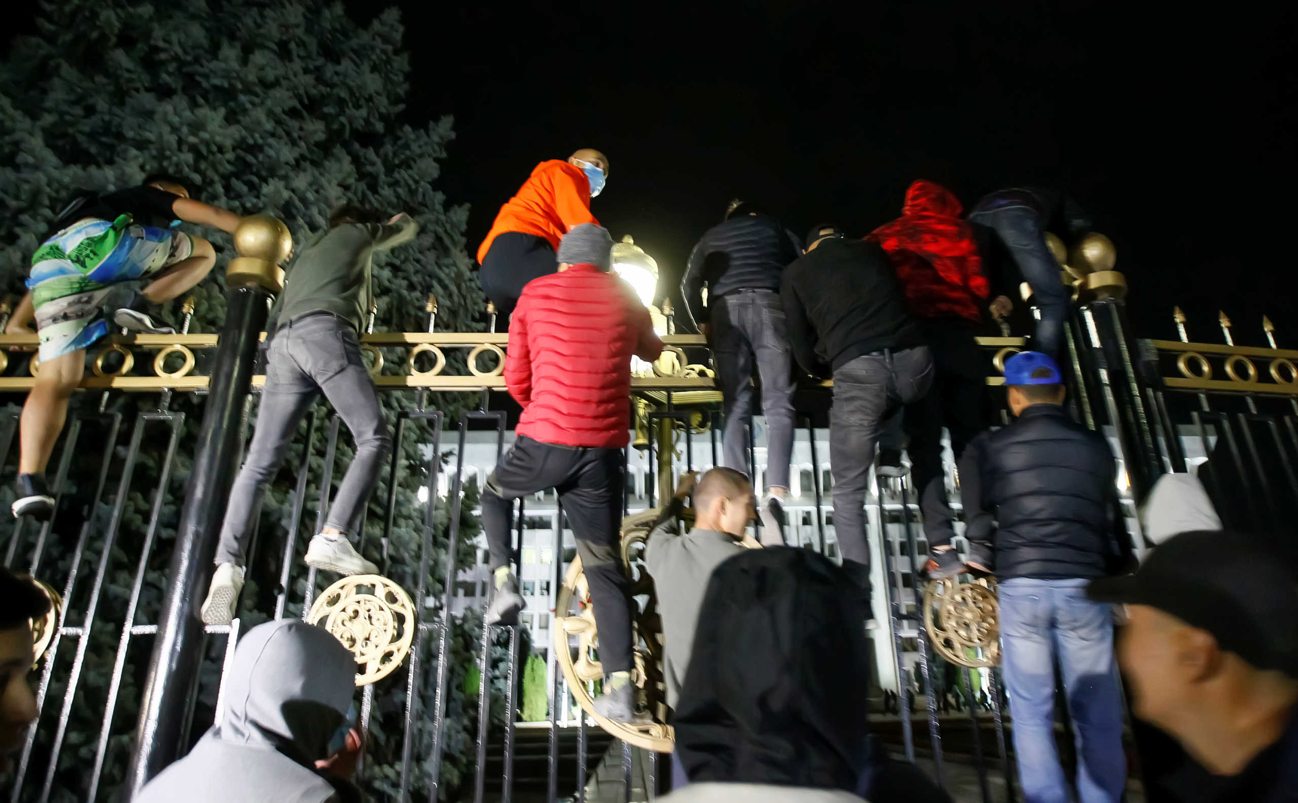 Protesters try to break into the government headquarters during a rally against the result of a parliamentary election in Bishkek, Kyrgyzstan, October 5, 2020.  REUTERS
