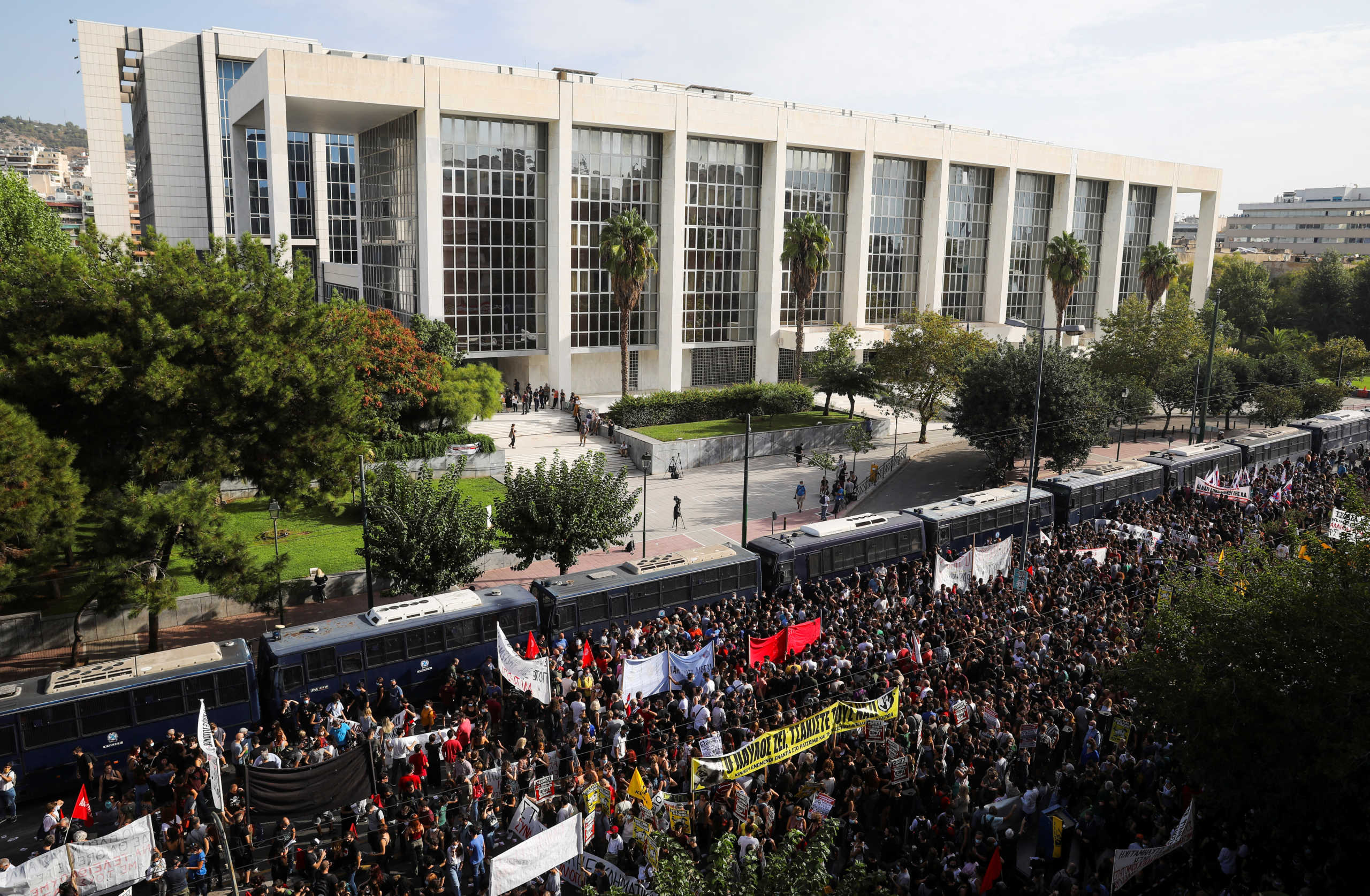 Demonstrators protest outside the court, ahead of a trial of leaders and members of the far-right Golden Dawn, in Athens, Greece, October 7, 2020. REUTERS