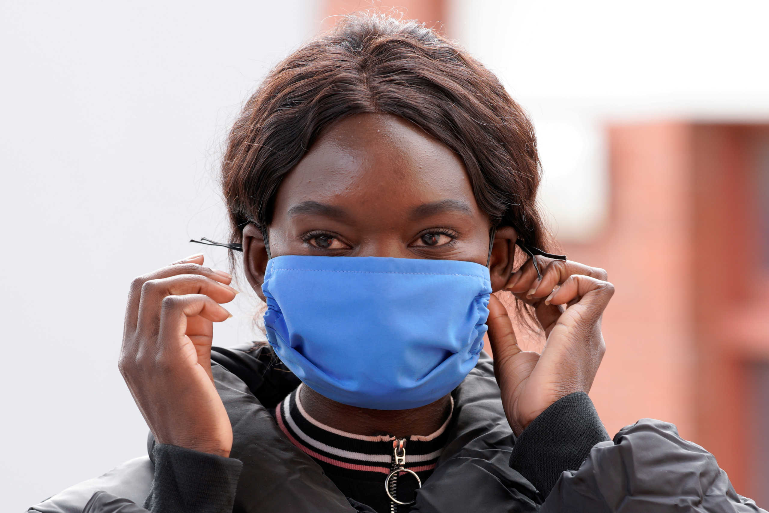 FILE PHOTO: Nancy Oziya, social sewing teacher at The Social Studio, poses for a photograph wearing a face mask made to help curb the spread of the coronavirus disease (COVID-19) in Melbourne, Australia, August 26, 2020. REUTERS