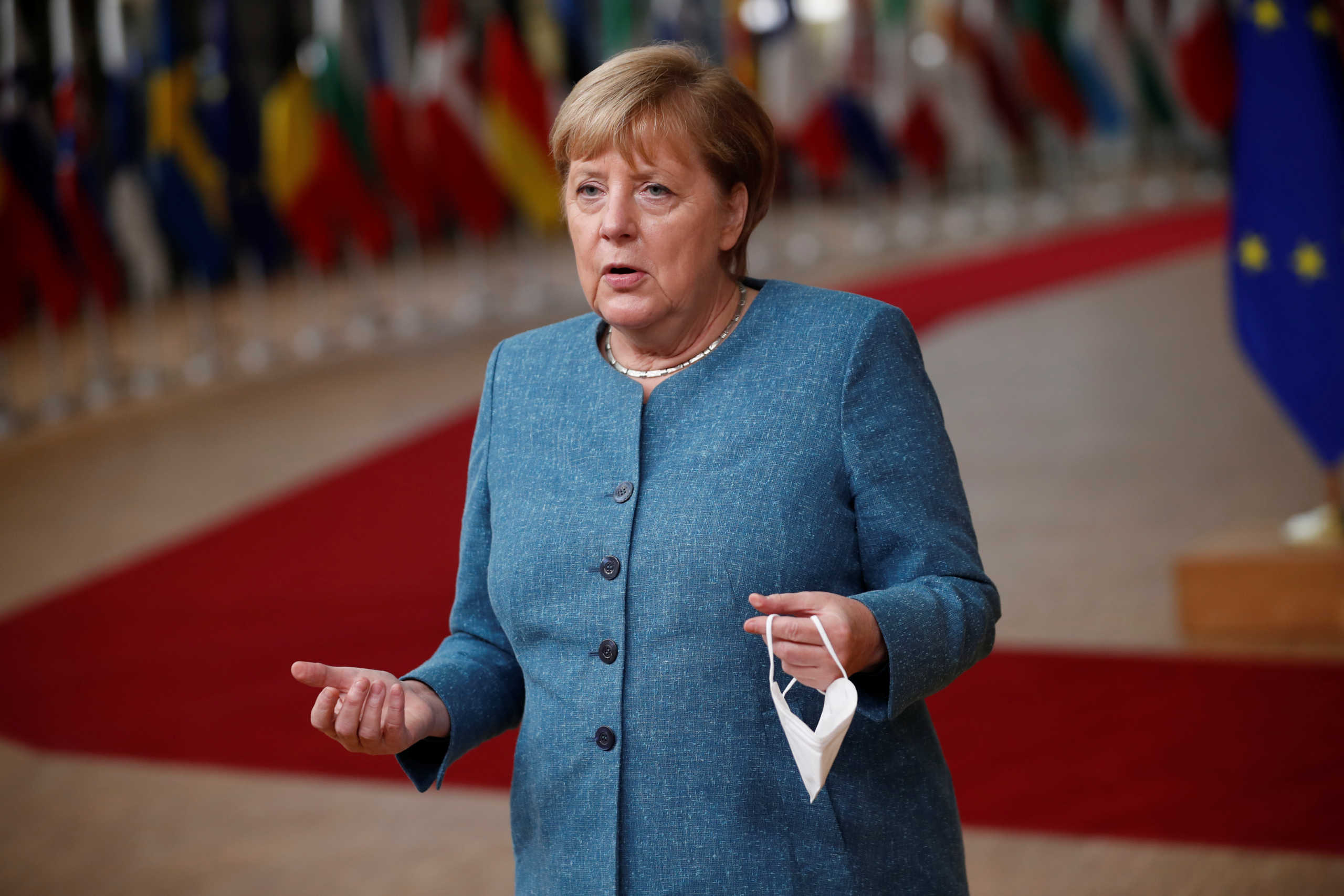 German Chancellor Angela Merkel speaks to the media as she arrives for the second face-to-face European Union summit since the coronavirus disease (COVID-19) outbreak, in Brussels, Belgium October 1, 2020. Francisco Seco