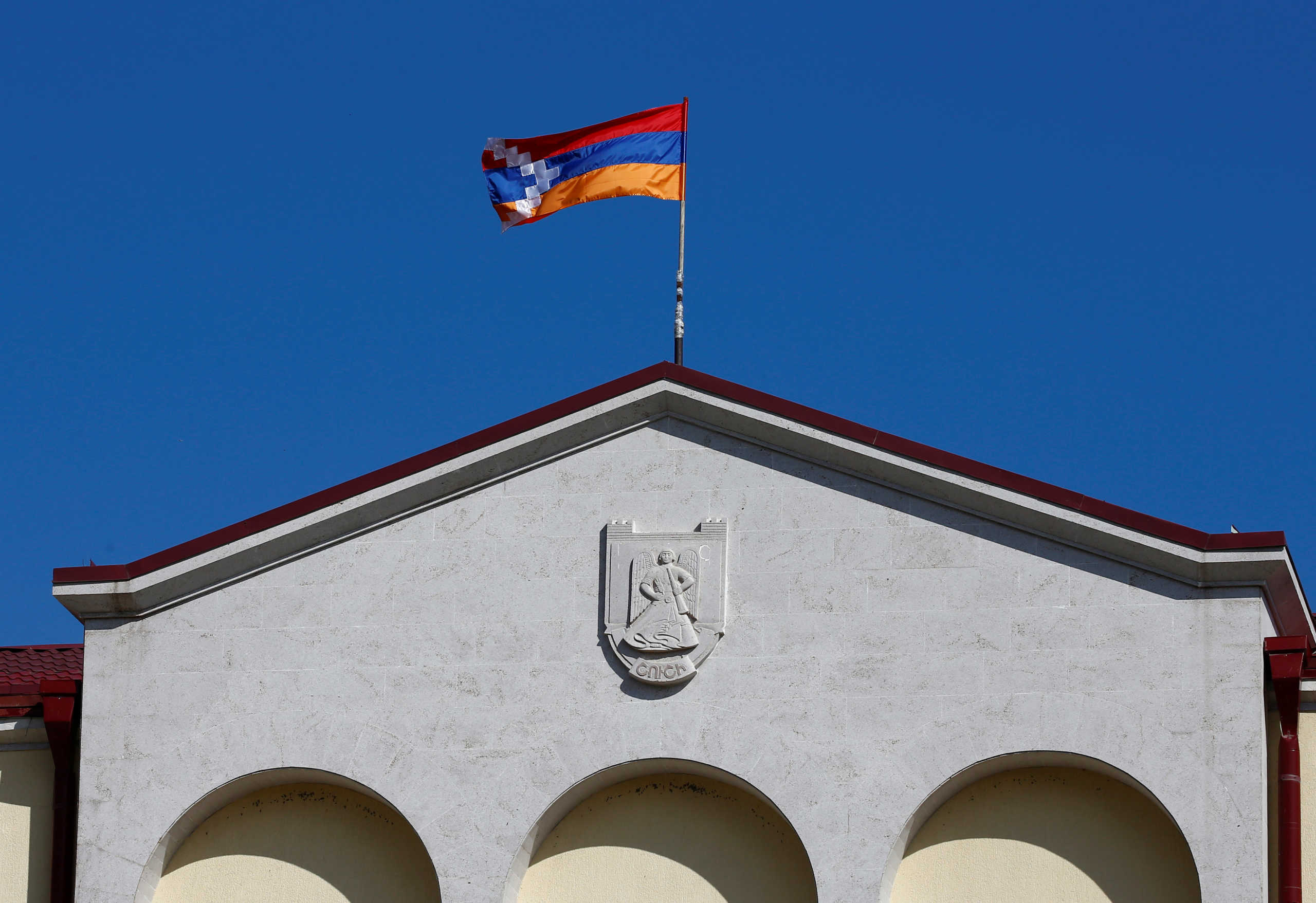 Flag of the breakaway region of Nagorno-Karabakh is seen on a building, in Shushi,  October 9, 2020. REUTERS