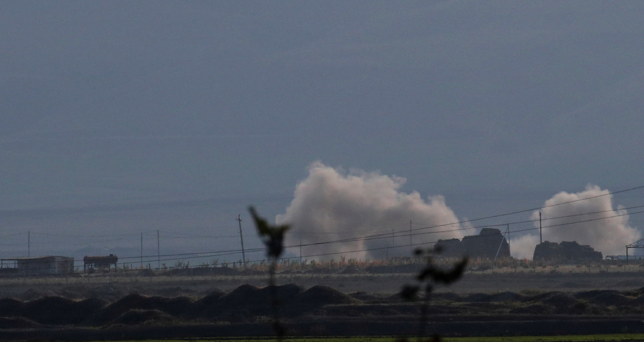 Smoke rises as Azerbaijan forces shell targets during the fighting over the breakaway region of Nagorno-Karabakh near the city of Terter, Azerbaijan October 9, 2020. REUTERS