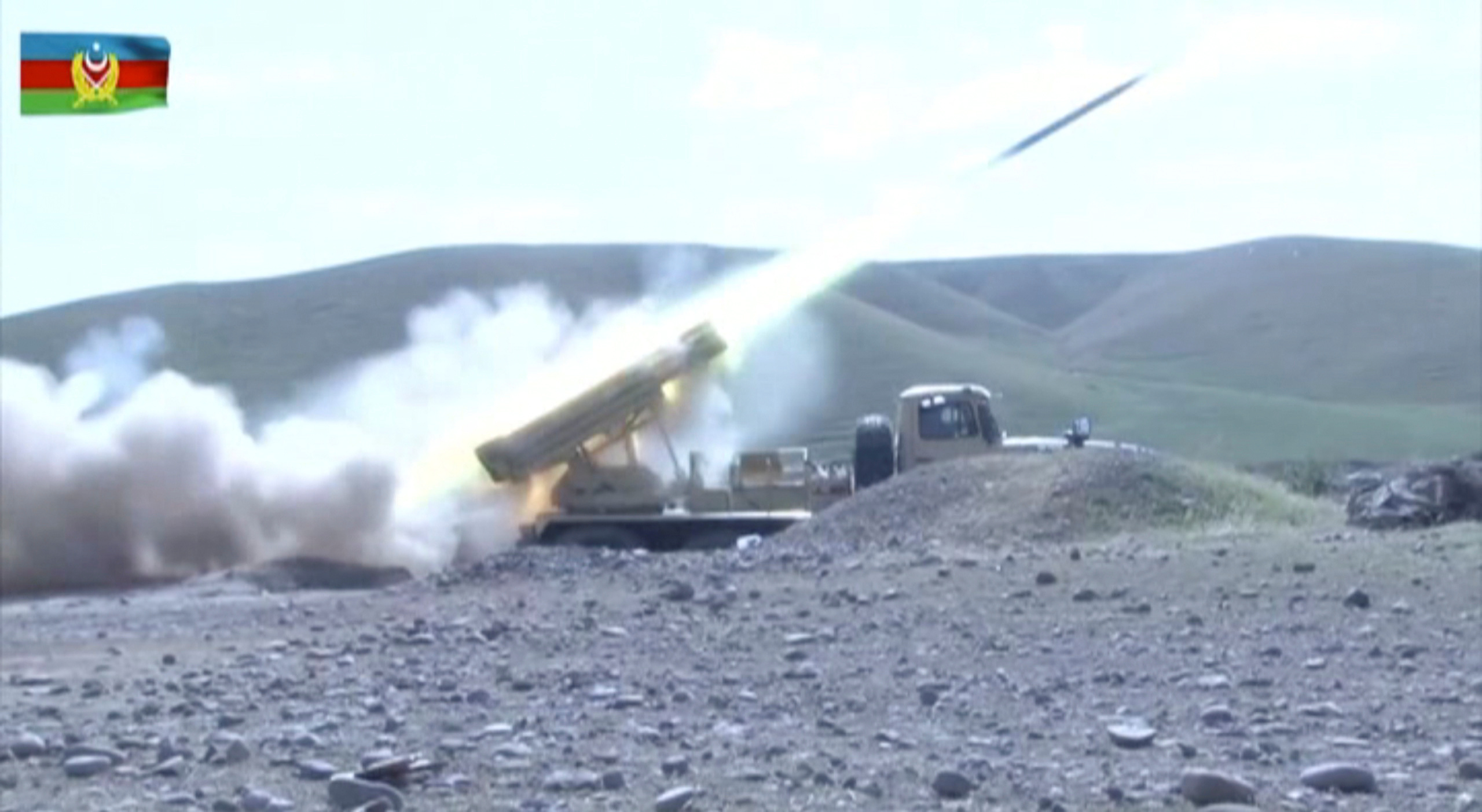 A still image from a video released by Azerbaijan's Defence Ministry shows a multiple rocket launcher of the Azeri armed forces performing strikes during clashes over the breakaway region of Nagorno-Karabakh in an unknown location in Azerbaijan, in this still image from footage released September 30, 2020. Defence Ministry of Azerbaijan