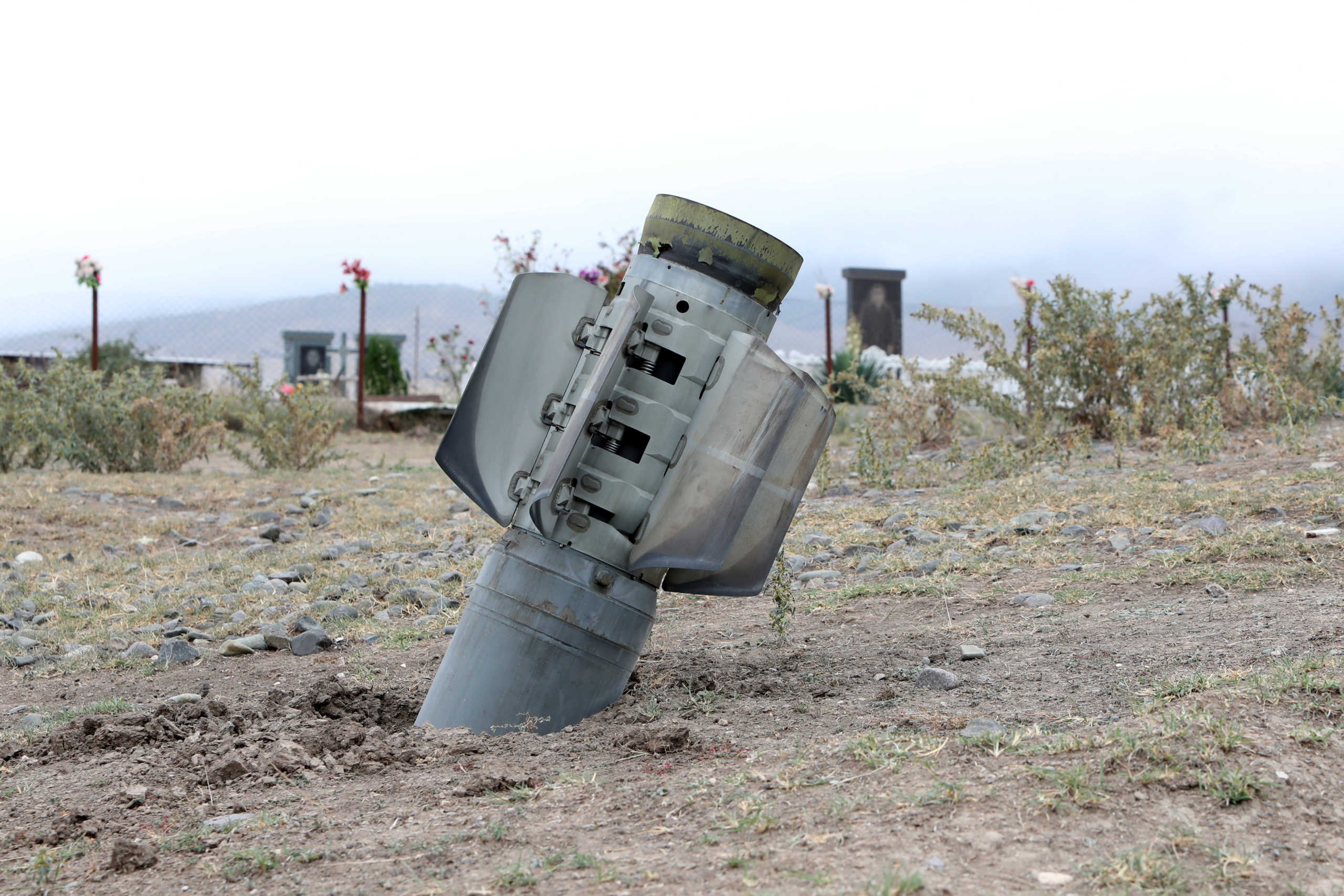 The remains of a rocket shell are seen near a graveyard at the town of Ivanyan (Khojaly) in the breakaway region of Nagorno-Karabakh October 1, 2020. Vahram Baghdasaryan