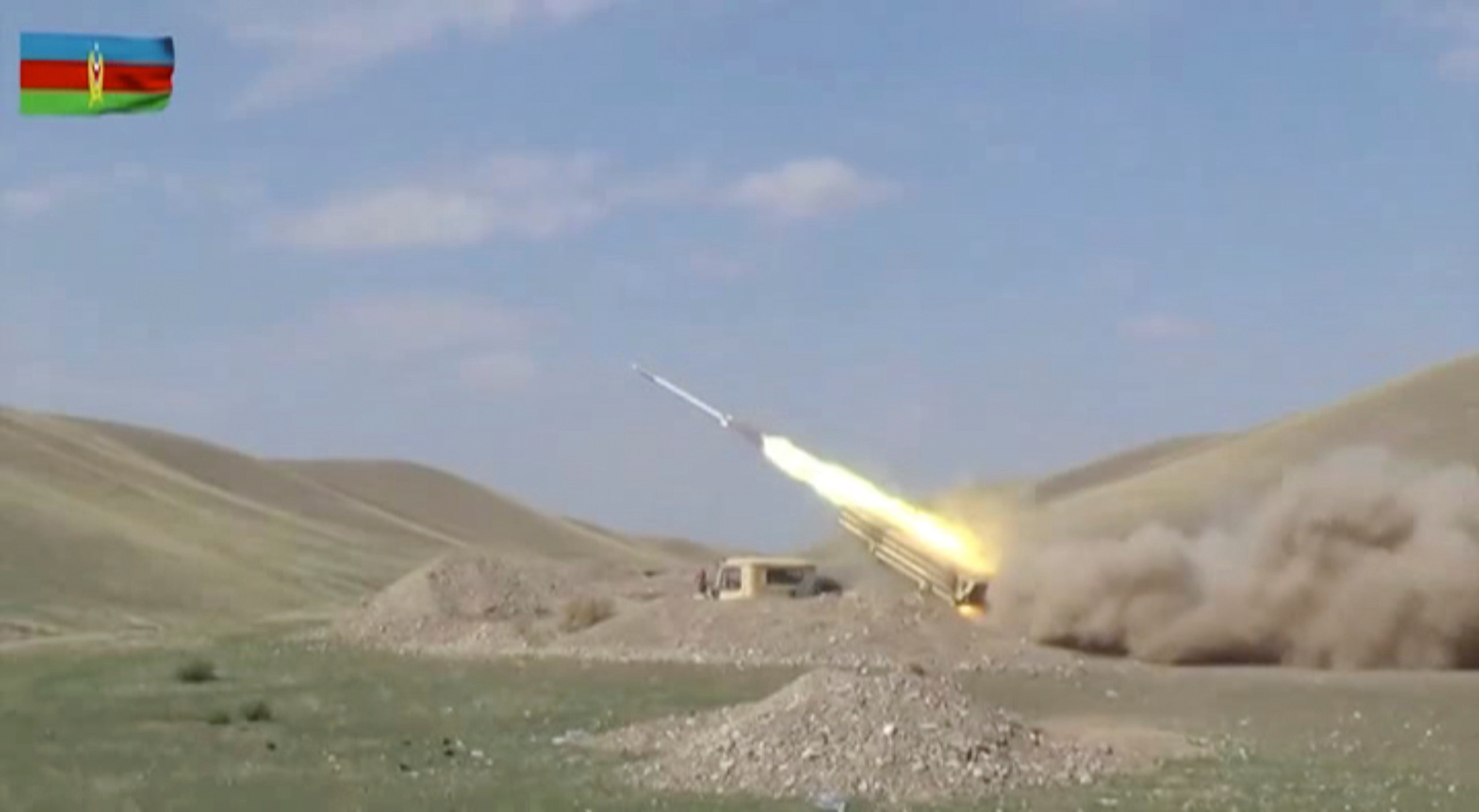 A still image from a video released by Azerbaijan's Defence Ministry shows a multiple rocket launcher of the Azeri armed forces performing strikes during clashes over the breakaway region of Nagorno-Karabakh in Azerbaijan, in this still image from footage released September 30, 2020. Defence Ministry of Azerbaijan