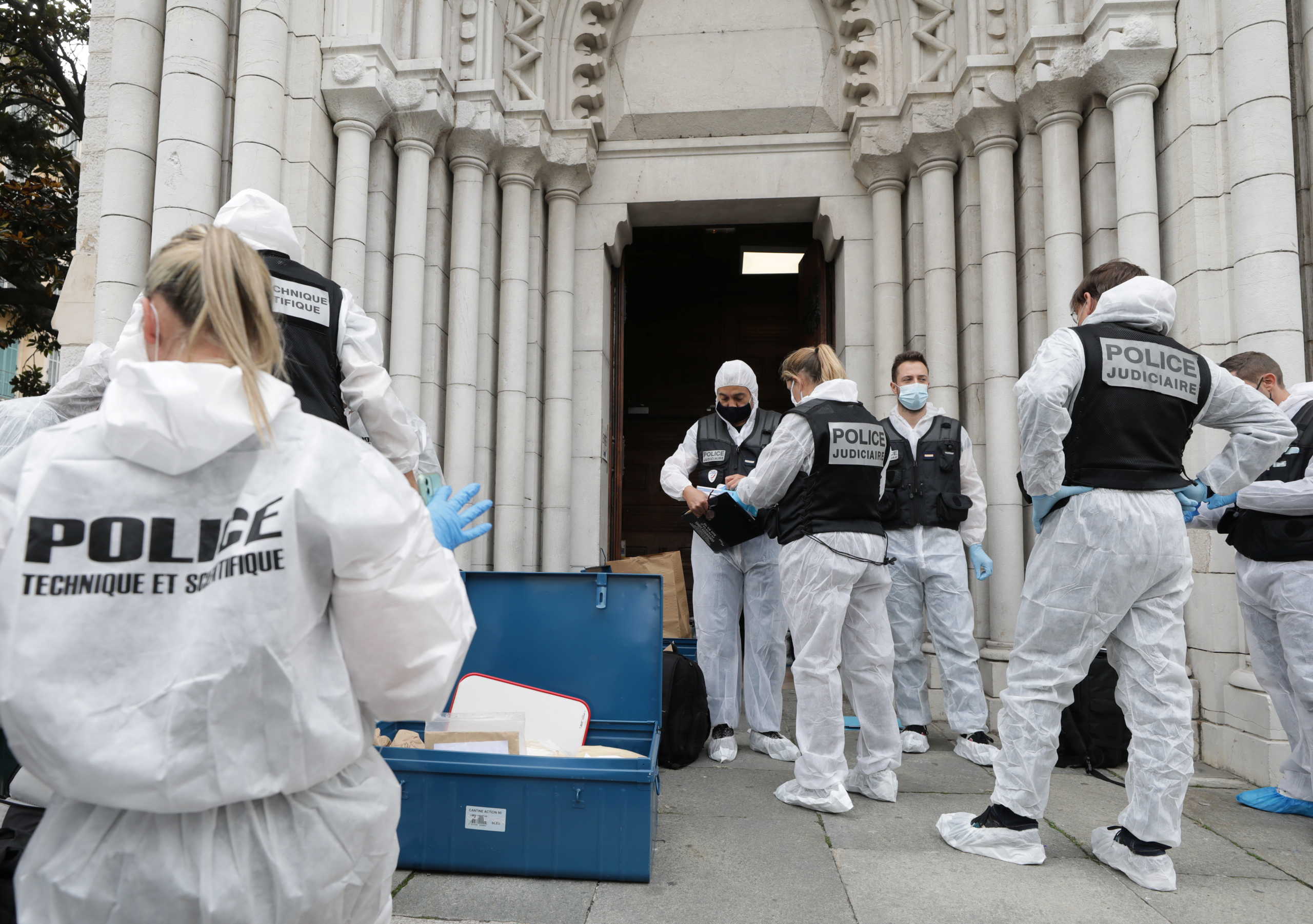 Forensic specialists inspect the scene of a reported knife attack at Notre Dame church in Nice, France, October 29, 2020. REUTERS