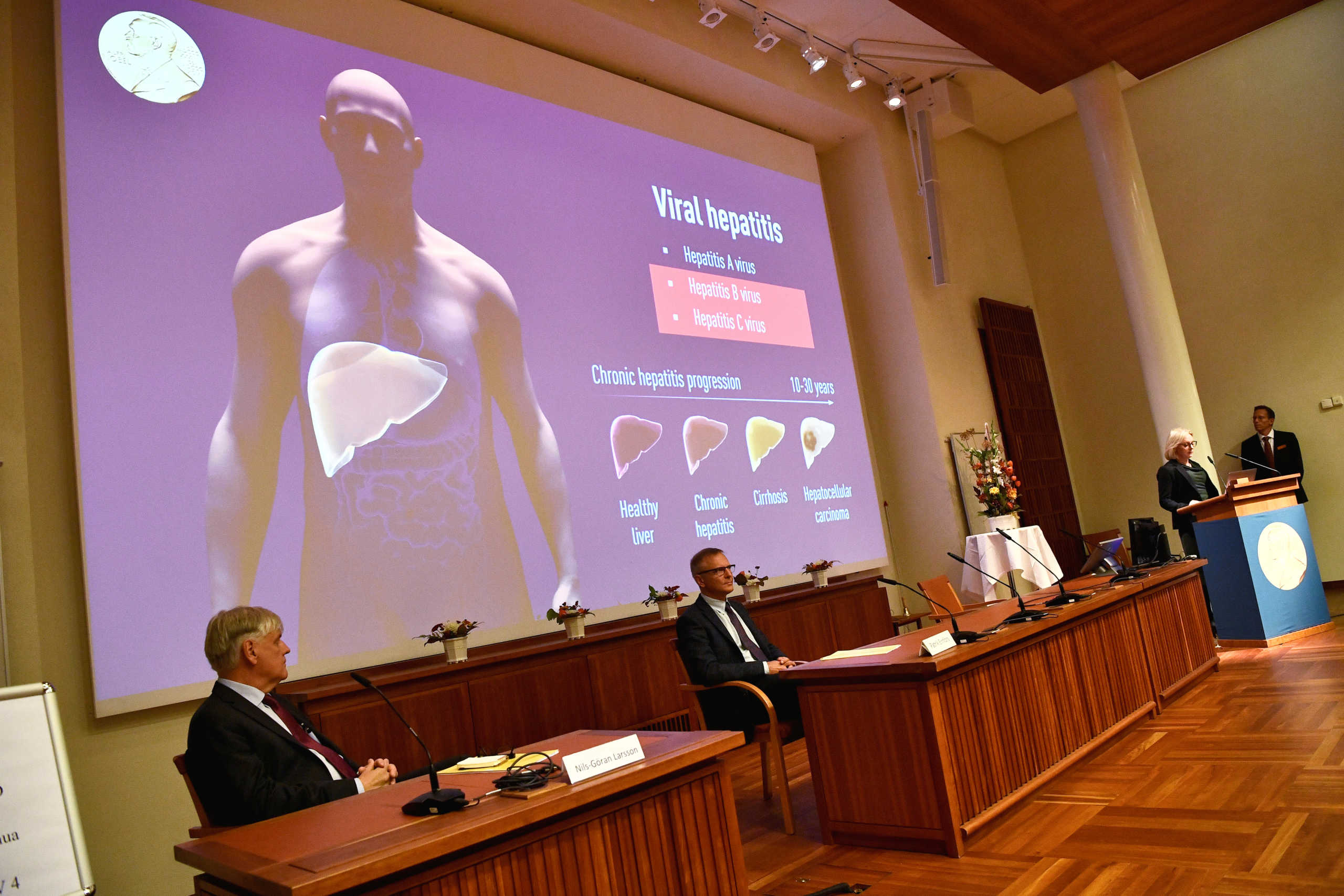 Nils-Goran Larsson, Patrik Ernfors, Gunilla Karlsson Hedestam and Thomas Perlmann (Secretary), of the Nobel Committee for Physiology or Medicine present the winners of the 2020 Nobel Prize in Physiology or Medicine Harvey J. Alter, Michael Houghton and Charles M. Rice, during a press conference at the Karolinska Institute in Stockholm, Sweden, October 5, 2020.  Claudio Bresciani
