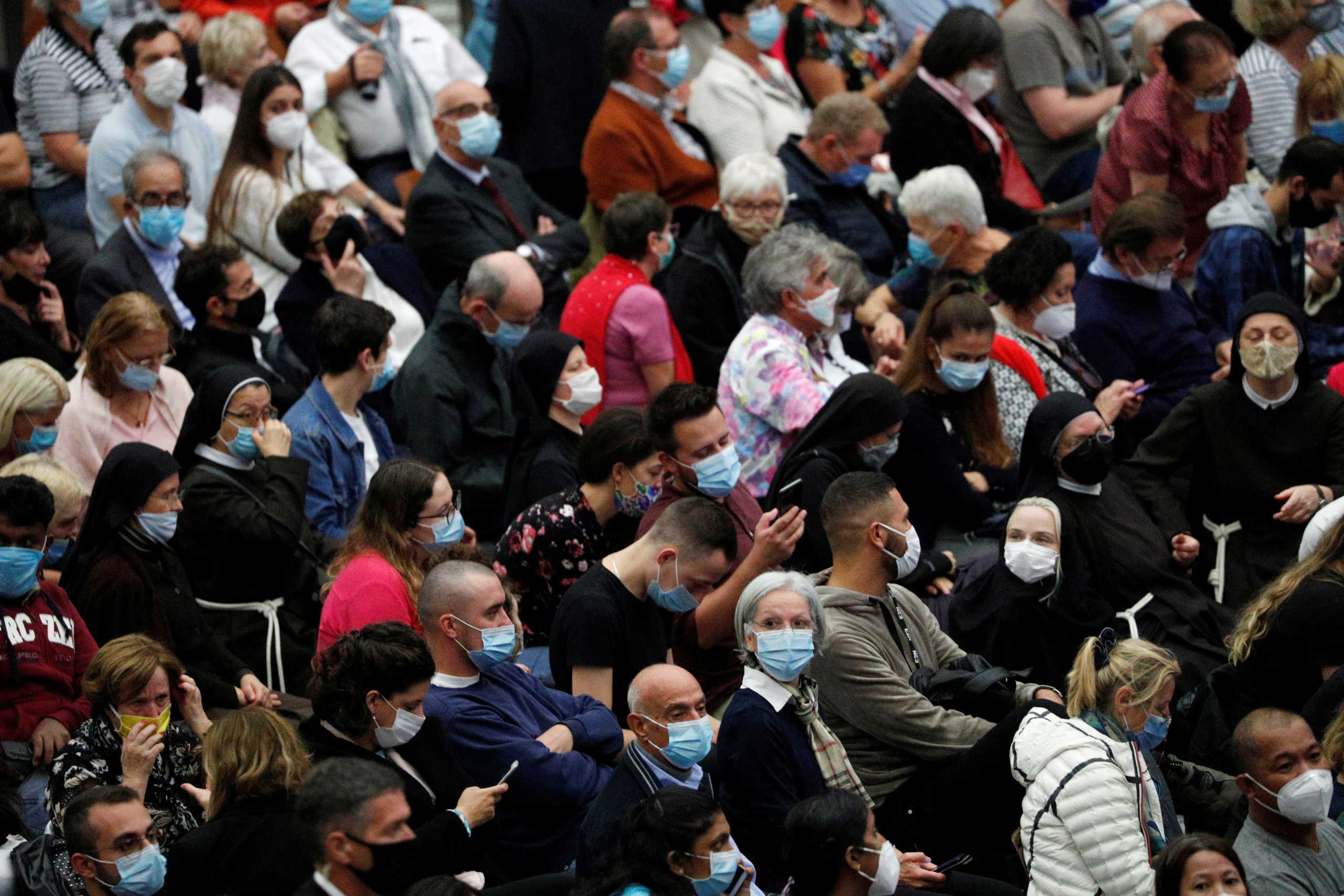 People wait for Pope Francis weekly general audience in Aula Paolo VI at the Vatican, October 7, 2020. REUTERS