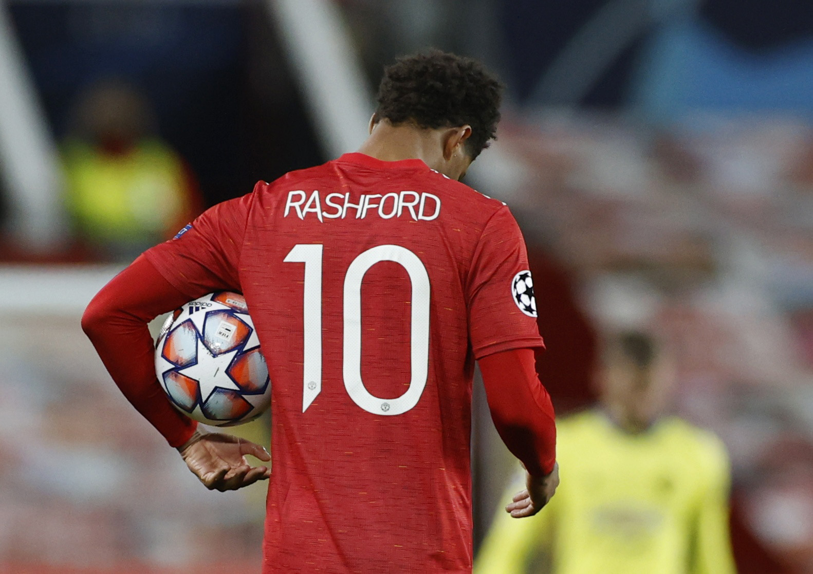 Soccer Football - Champions League - Group H - Manchester United v RB Leipzig - Old Trafford, Manchester, Britain - October 28, 2020 Manchester United's Marcus Rashford celebrates with the match ball after the match REUTERS
