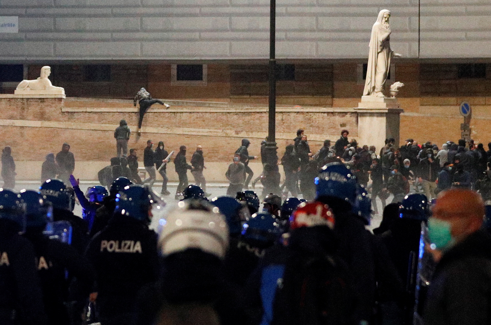 Far right demonstrators clash with police during a protest over the restrictions put in place to curb the coronavirus disease (COVID-19) infections in Rome, Italy October 27, 2020. REUTERS