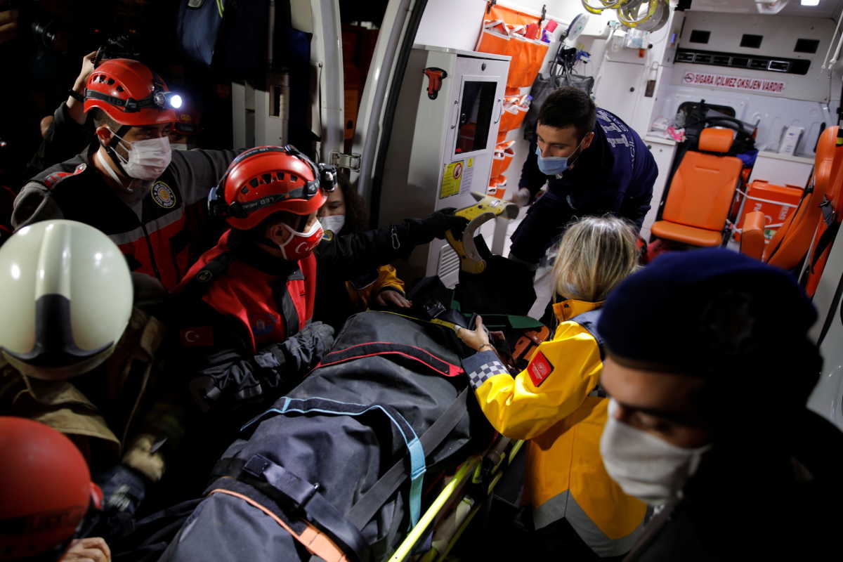 Emergency personnel transport a victim on a stretcher onto an ambulance after an earthquake struck the Aegean Sea, in the coastal province of Izmir, Turkey, October 31, 2020. REUTERS