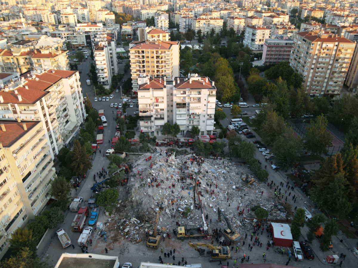 An aerial view shows rescue workers searching for survivors at a collapsed building after an earthquake in the Aegean port city of Izmir, Turkey October 31, 2020. Picture taken with a drone. REUTERS