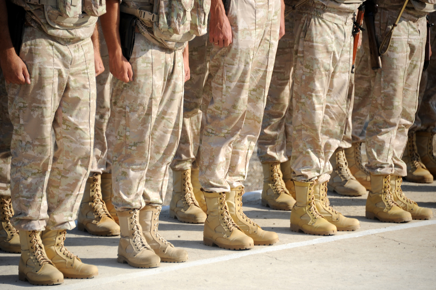 Russian soldiers line up in front of their commander at the Russian military base of Hmeimim, located south-east of the city of Latakia in Hmeimim, Latakia Governorate, Syria, on September 26, 2019. - With military backing from Russia, President Bashar al-Assad's forces have retaken large parts of Syria from rebels and jihadists since 2015, and now control around 60 percent of the country. Russia often refers to troops it deployed in Syria as military advisers even though its forces and warplanes are also directly involved in battles against jihadists and other rebels (Photo by Maxime POPOV