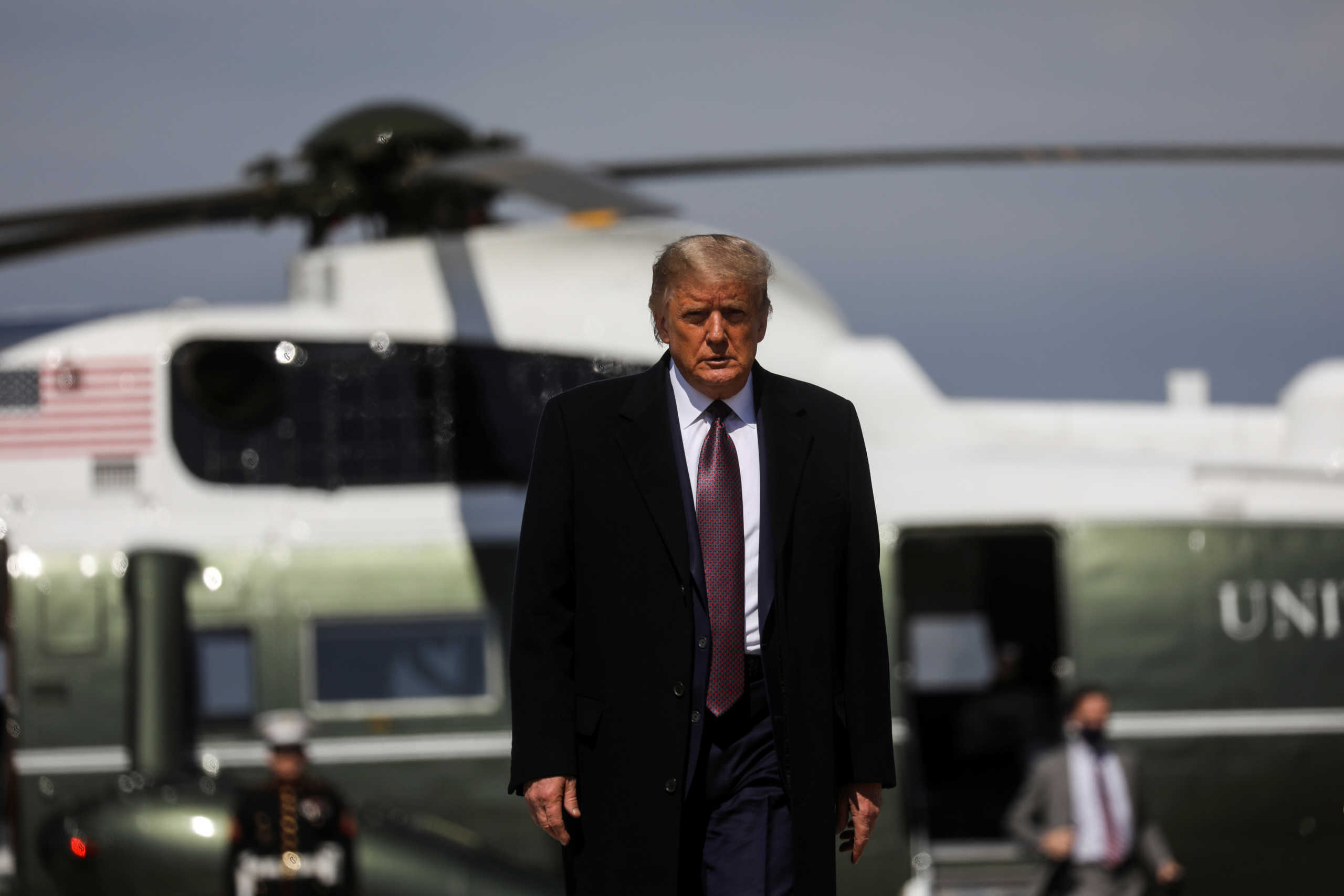 U.S. President Donald Trump walks from Marine One to board Air Force One as he departs Washington on campaign travel to New Jersey at Joint Base Andrews, Maryland, U.S., October 1, 2020. REUTERS