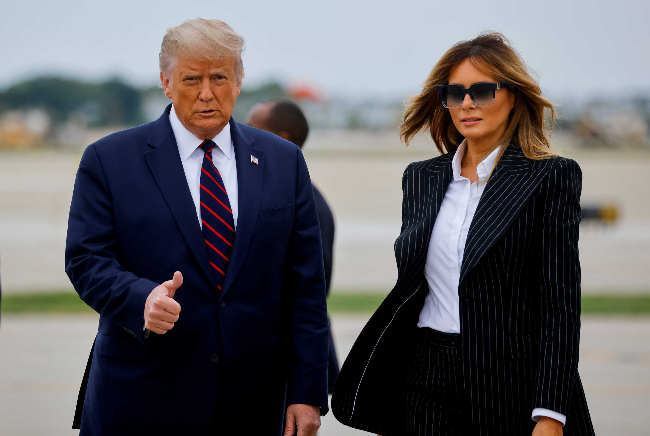 FILE PHOTO - U.S. President Donald Trump walks with first lady Melania Trump at Cleveland Hopkins International Airport in Cleveland, Ohio, U.S., September 29, 2020. REUTERS