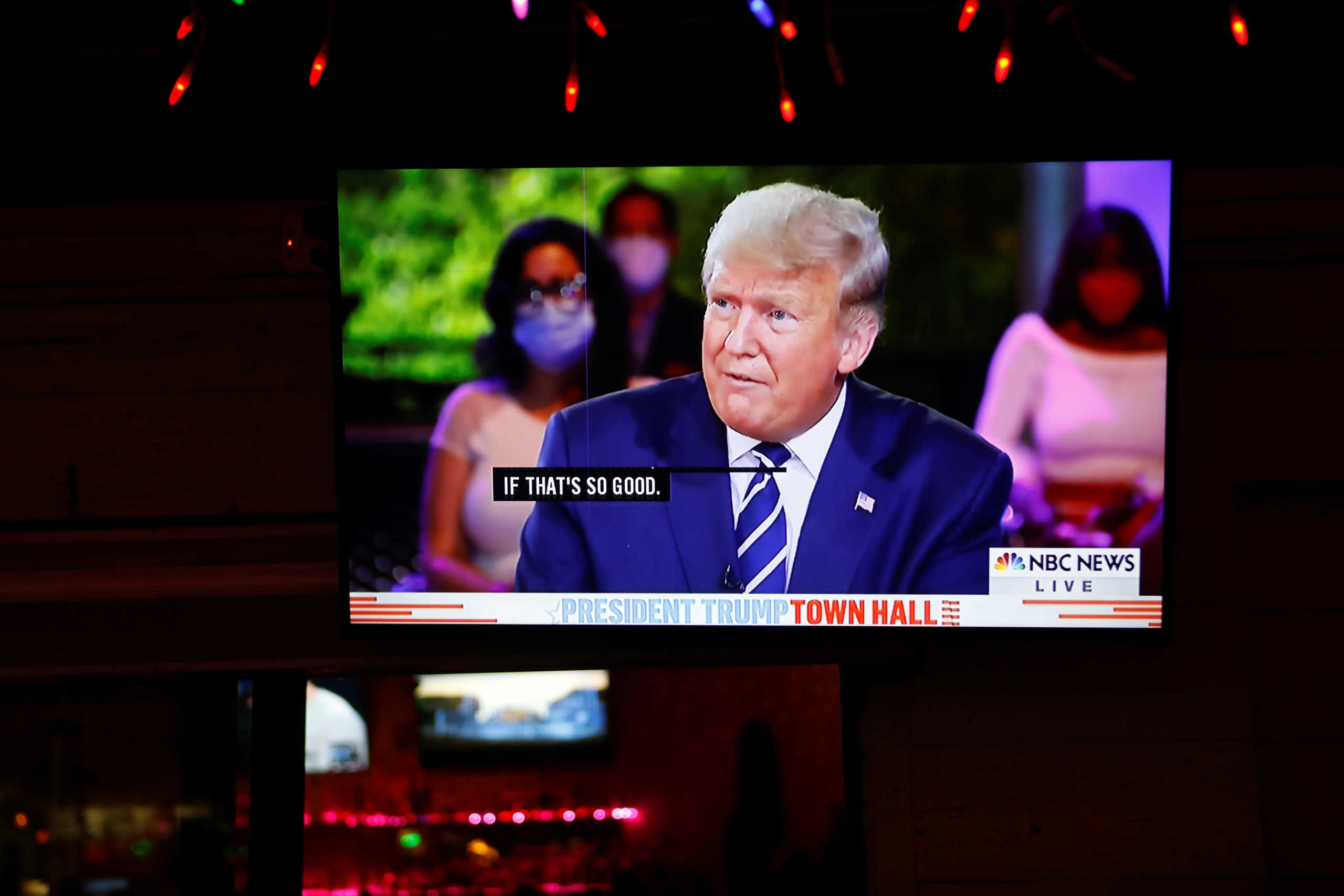 The town hall event of U.S. President Donald Trump is seen on a television monitor at Luv Child restaurant ahead of the election in Tampa, Florida, U.S. October 15, 2020. REUTERS