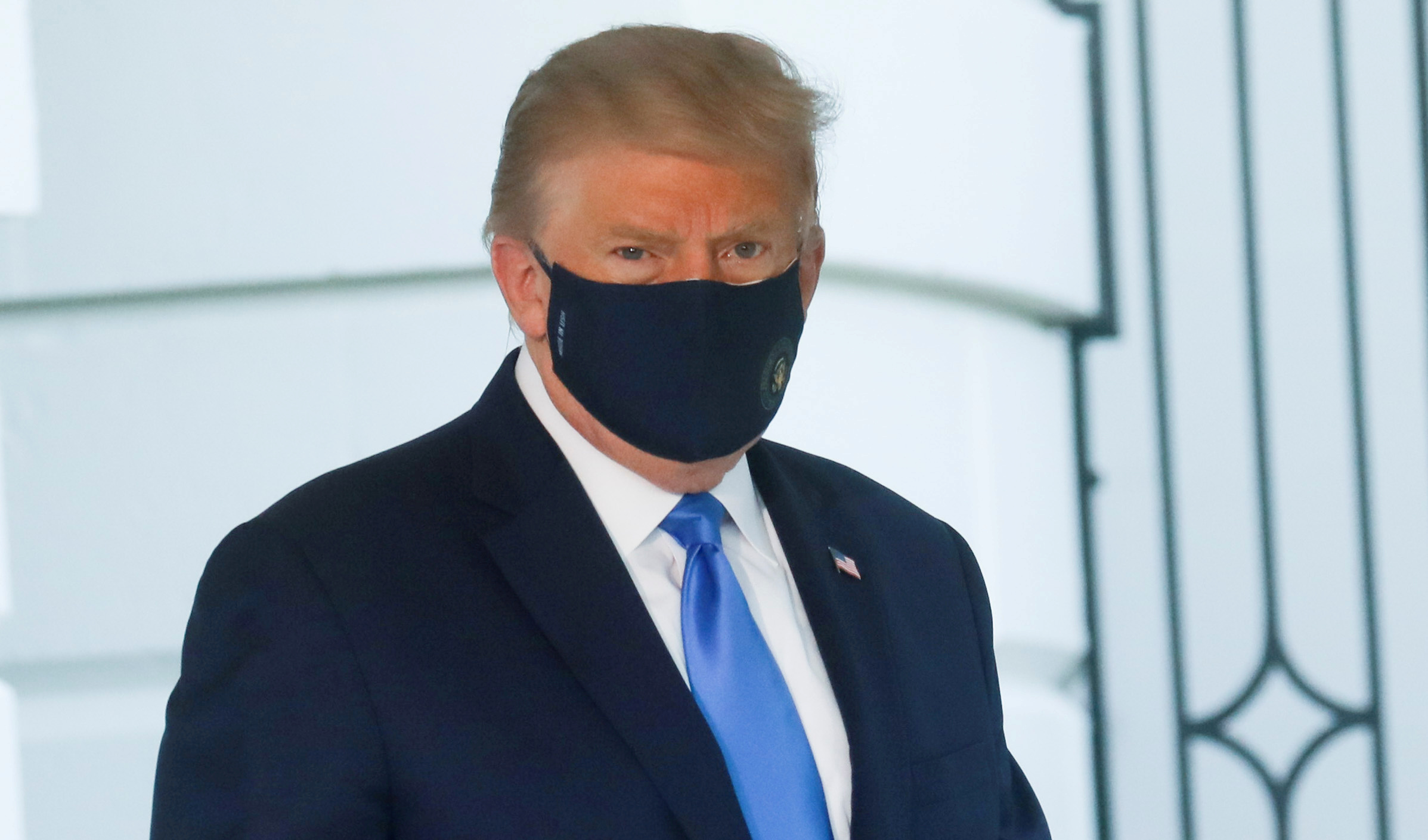 U.S. President Trump walks to the Marine One helicopter wearing a protective face mask as he departs the White House to fly to Walter Reed National Military Medical Center, where it was announced he will work for at least several days after testing positive for the coronavirus disease (COVID-19), on the South Lawn of the White House in Washington, U.S., October 2, 2020. REUTERS