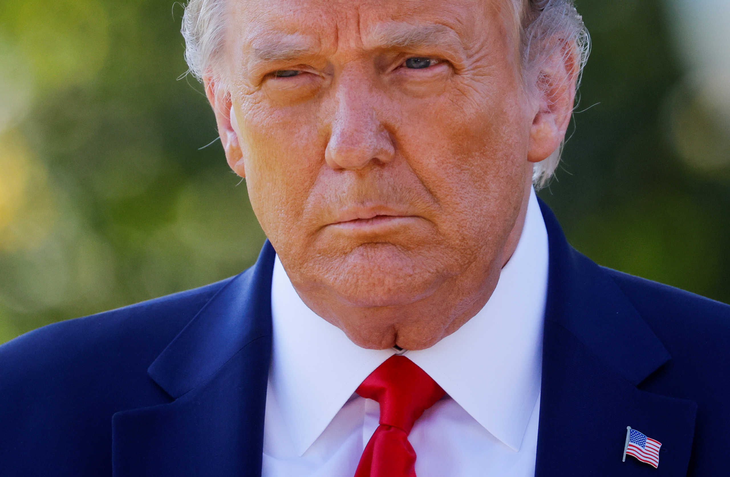 U.S. President Donald Trump approaches reporters as he departs on campaign travel to Minnesota from the South Lawn at the White House in Washington, U.S., September 30, 2020. Picture taken September 30, 2020. REUTERS