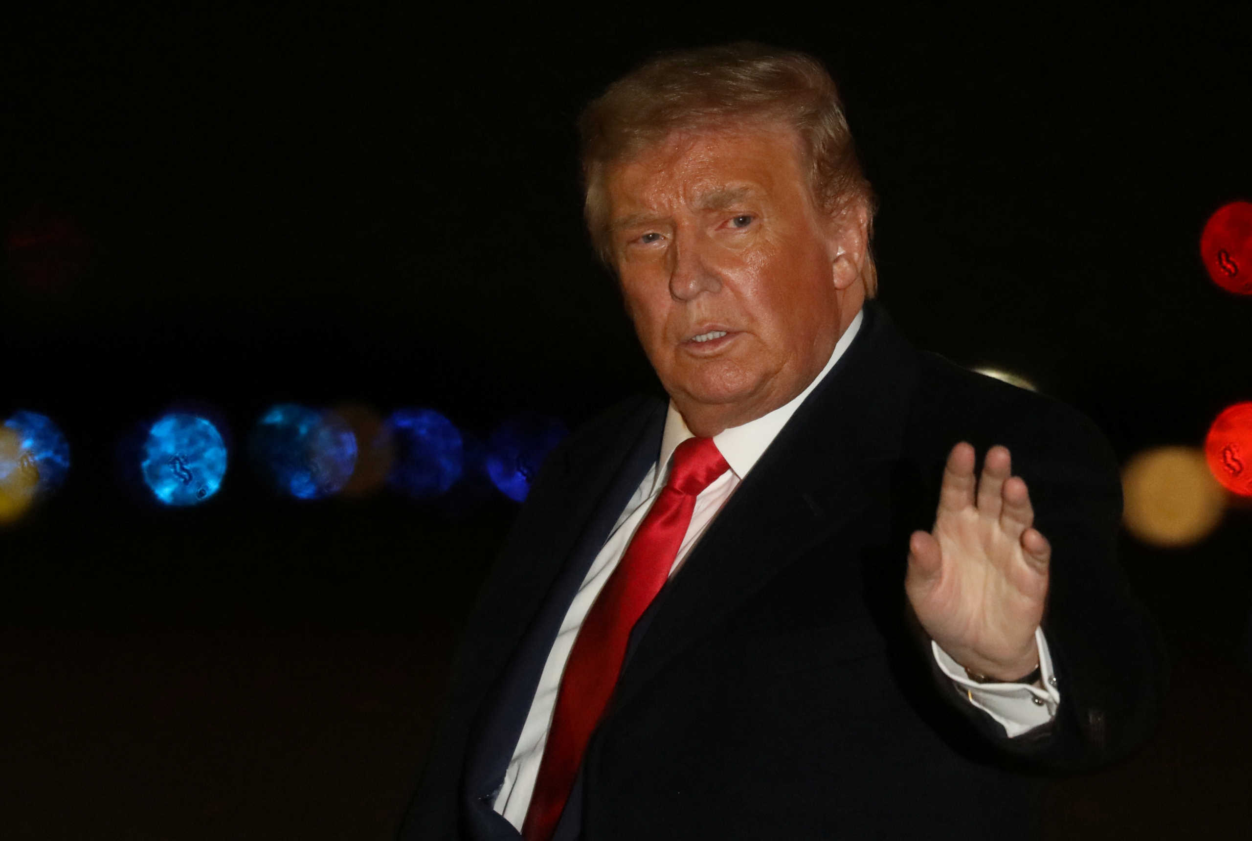 U.S. President Donald Trump waves to media after returning on Air Force One from a campaign rally in Minnesota to Joint Base Andrews in Maryland, U.S., October 1, 2020. President Trump recently announced he has tested positive for the coronavirus disease (COVID-19). Picture taken October 1, 2020. REUTERS