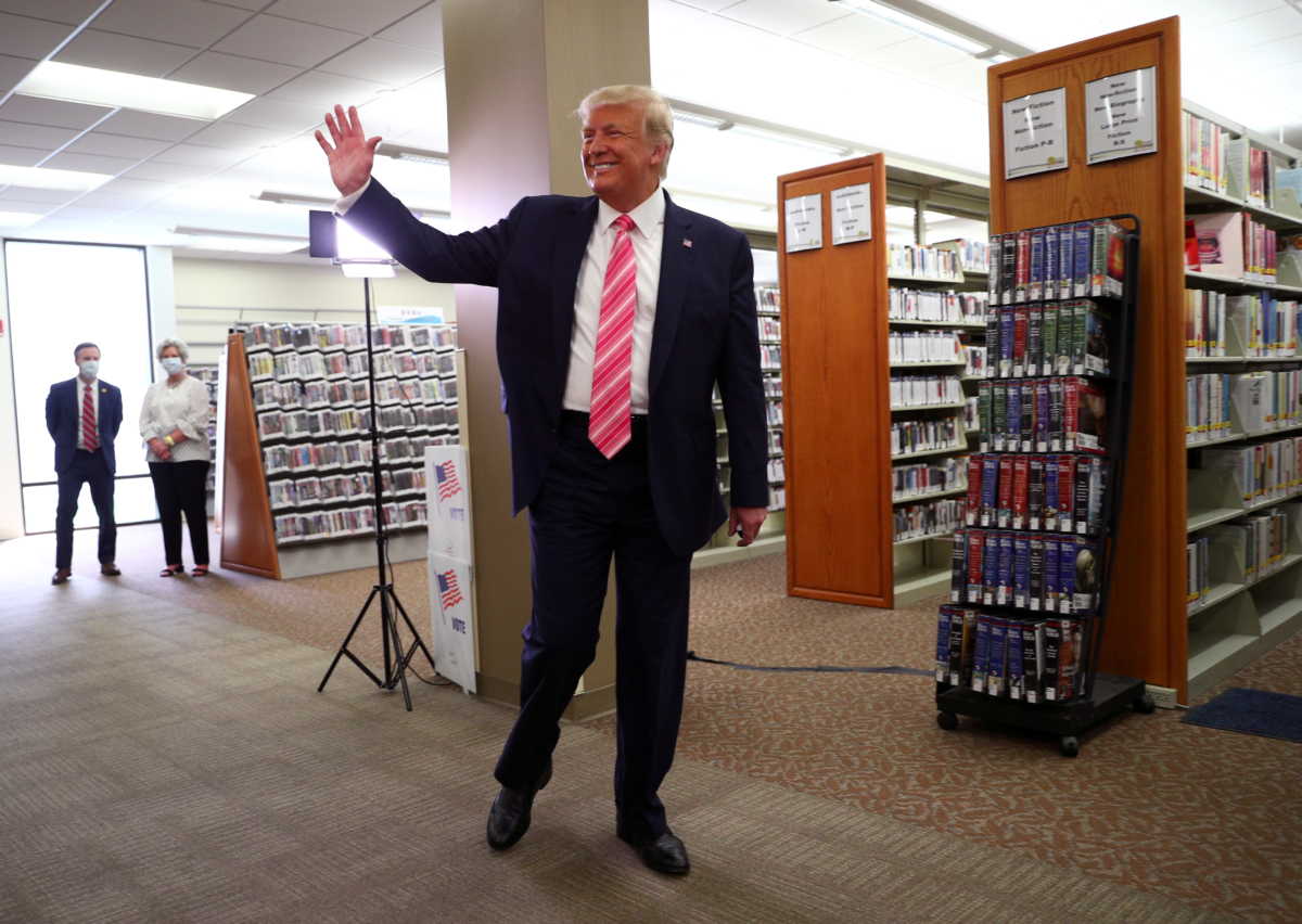 U.S. President Donald Trump waves after voting in the 2020 presidential election at the Palm Beach County Library in West Palm Beach, U.S., October 24, 2020. REUTERS