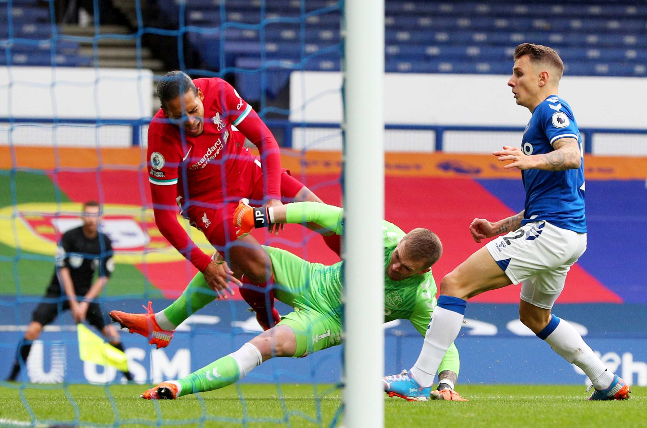 Soccer Football - Premier League - Everton v Liverpool - Goodison Park, Liverpool, Britain - October 17, 2020  Liverpool's Virgil van Dijk collides with Everton's Jordan Pickford Pool via REUTERS