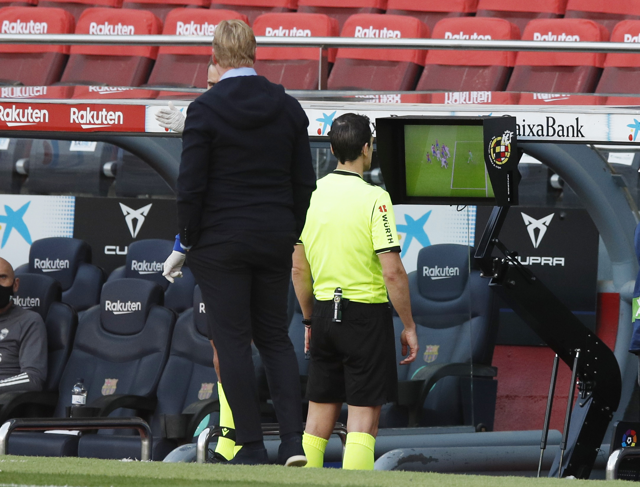 Soccer Football - La Liga Santander - FC Barcelona v Real Madrid - Camp Nou, Barcelona, Spain - October 24, 2020 Referee Juan Martinez Munuera refers to VAR REUTERS