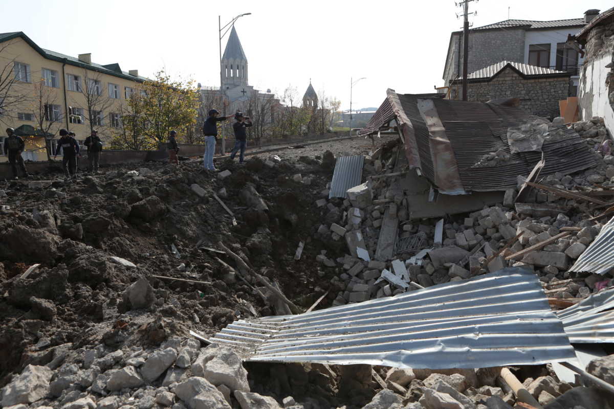 A view shows a crater and the ruins of a building following recent shelling in the town of Shushi (Shusha), in the course of a military conflict over the breakaway region of Nagorno-Karabakh, October 28, 2020. Hayk Baghdasaryan