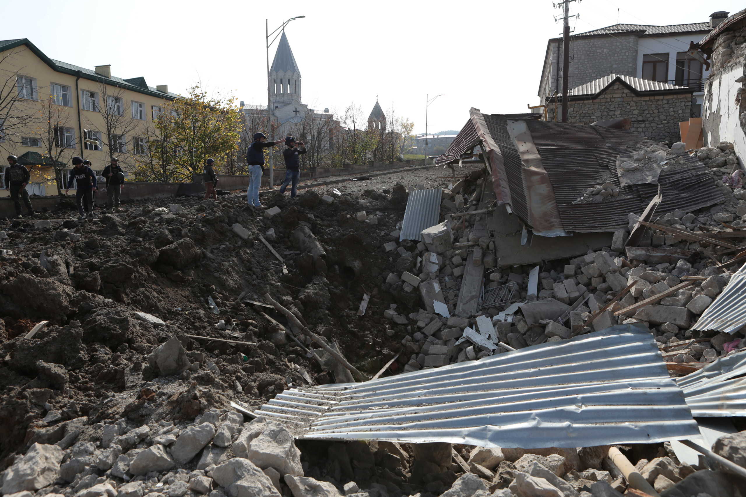 A view shows a crater and the ruins of a building following recent shelling in the town of Shushi (Shusha), in the course of a military conflict over the breakaway region of Nagorno-Karabakh, October 28, 2020. Hayk Baghdasaryan