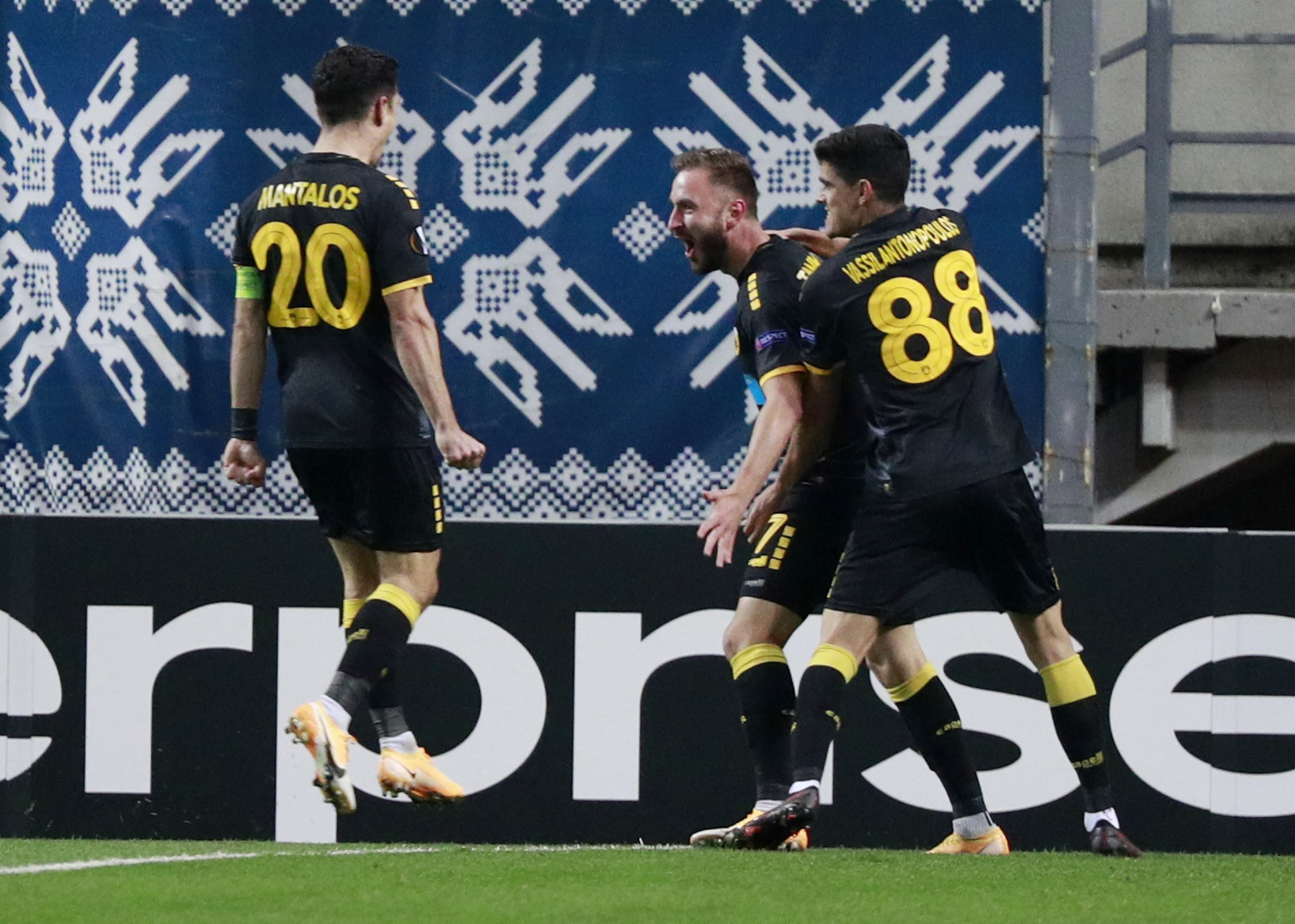 Soccer Football - Europa League - Group G - FC Zorya Luhansk v AEK Athens - Slavutych Arena, Zaporizhia, Ukraine - November 5, 2020 AEK Athens Muamer Tankovic celebrates scoring their first goal with Stavros Vasilantonopoulos and Petros Mantalos REUTERS