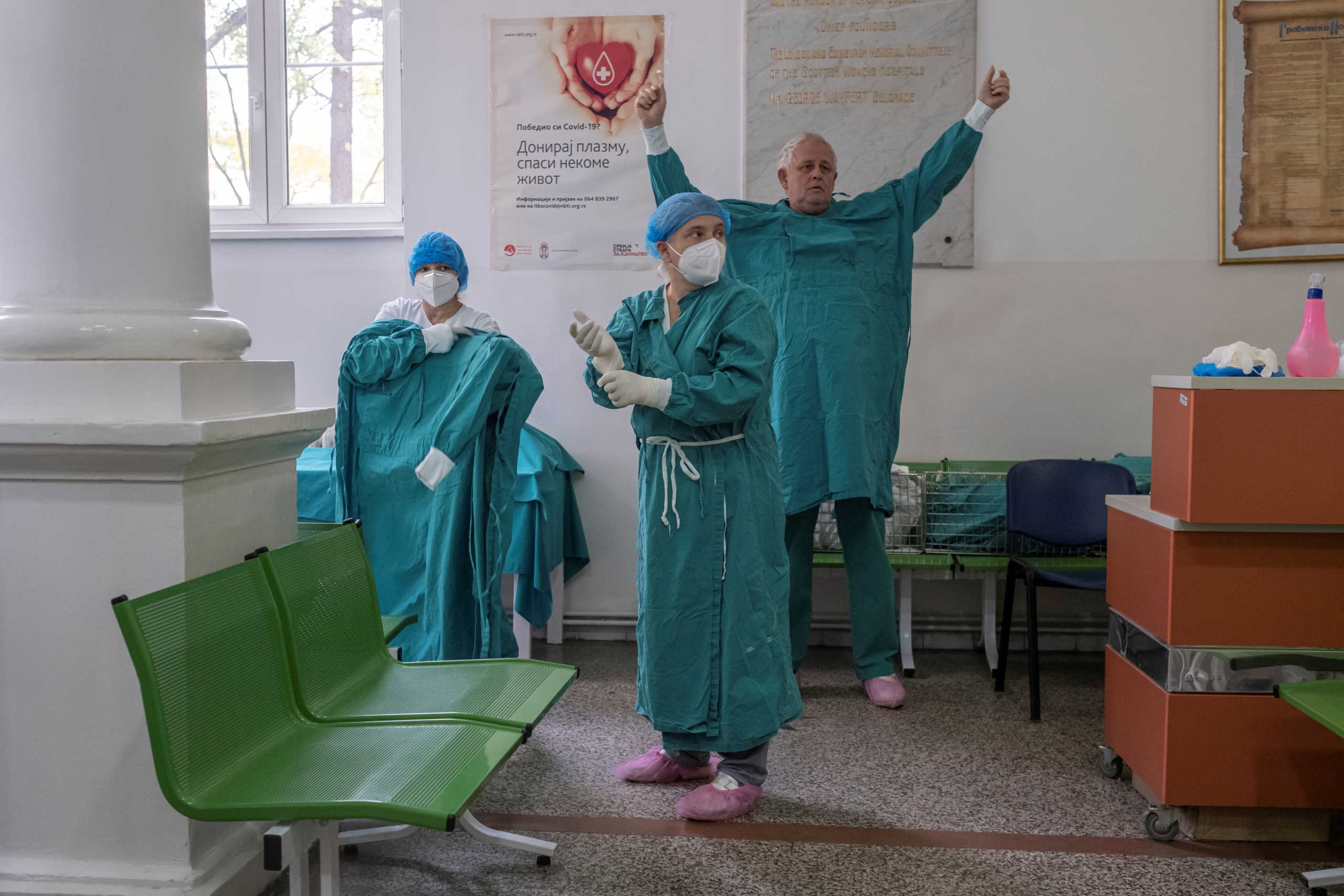 FILE PHOTO: Medical workers dress up before treating patients suffering from the coronavirus disease (COVID-19) at Clinical Hospital Center "Dr Dragisa Misovic" in Belgrade, Serbia, October 29, 2020. REUTERS