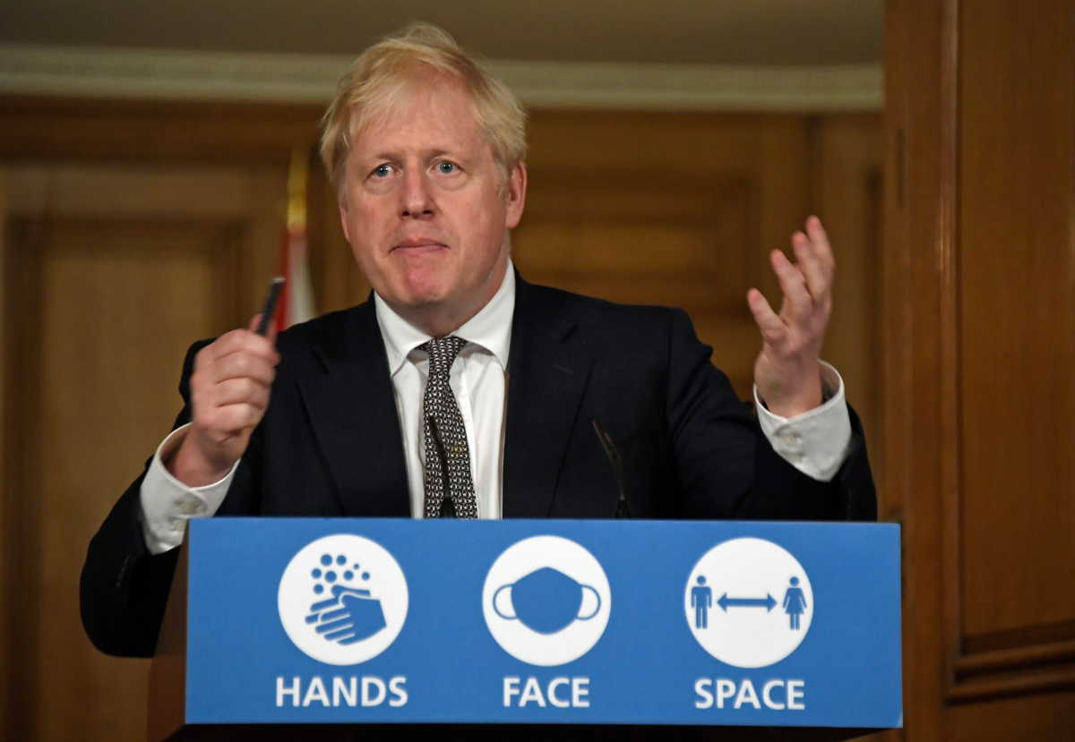 Britain's Prime Minister Boris Johnson gestures as he speaks during a press conference where he is expected to announce new restrictions to help combat the coronavirus disease (COVID-19) outbreak, at 10 Downing Street in London, Britain October 31, 2020. Alberto Pezzali