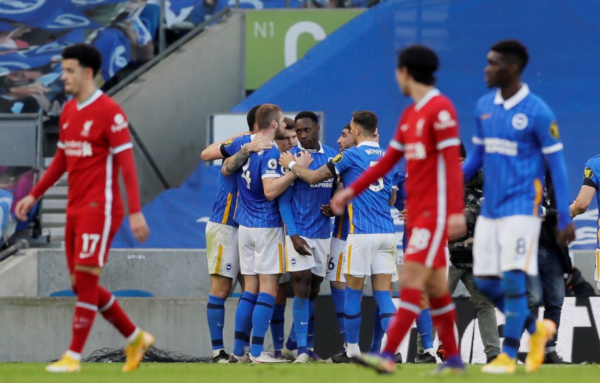 Soccer Football - Premier League - Brighton & Hove Albion v Liverpool - The American Express Community Stadium, Brighton, Britain - November 28, 2020 Brighton & Hove Albion's Pascal Gross celebrates scoring their first goal from the penalty spot with teammates Pool via REUTERS