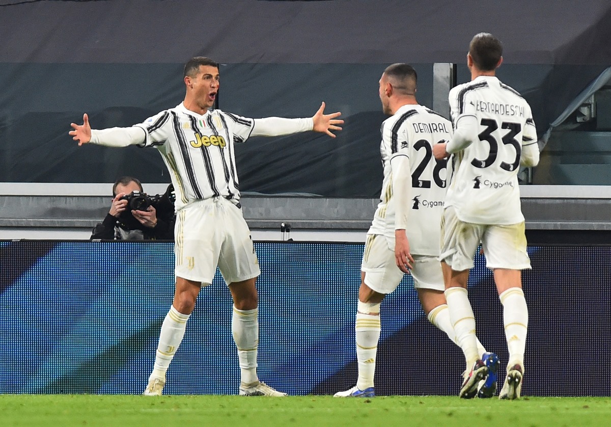 Soccer Football - Serie A - Juventus v Cagliari - Allianz Stadium, Turin, Italy - November 21, 2020 Juventus' Cristiano Ronaldo celebrates scoring their second goal with Merih Demiral and Federico Bernardeschi REUTERS