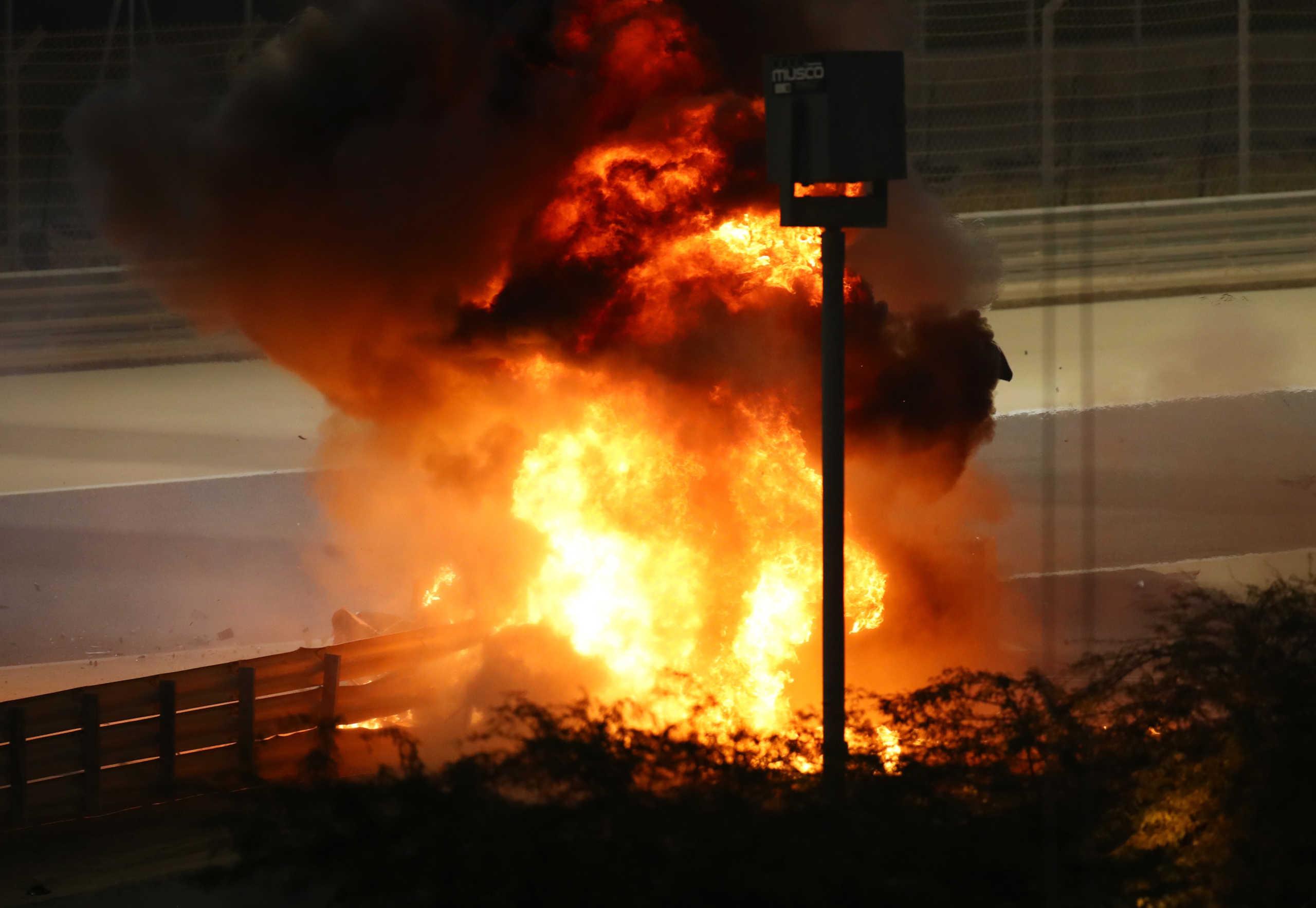 Formula One F1 - Bahrain Grand Prix - Bahrain International Circuit, Sakhir, Bahrain - November 29, 2020 Flames seen from the crash scene after Haas' Romain Grosjean crashed out at the start of the race Pool via REUTERS