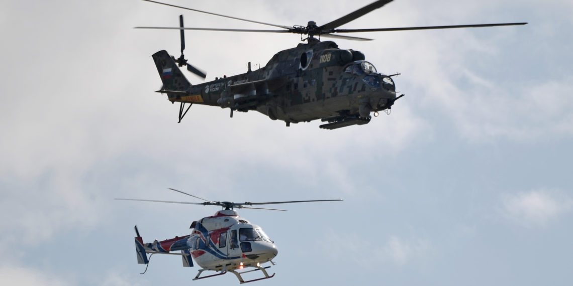Russian Ansat and Mi-24 helicopters fly at the MAKS 2019 air show in Zhukovsky, outside Moscow, Russia, August 27, 2019.  Sputnik