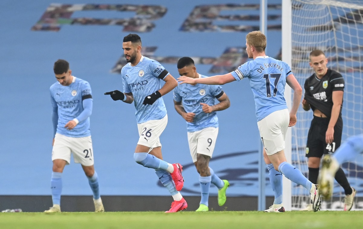 Soccer Football - Premier League - Manchester City v Burnley - Etihad Stadium, Manchester, Britain - November 28, 2020 Manchester City's Riyad Mahrez celebrates scoring their second goal with teammates Pool via REUTERS